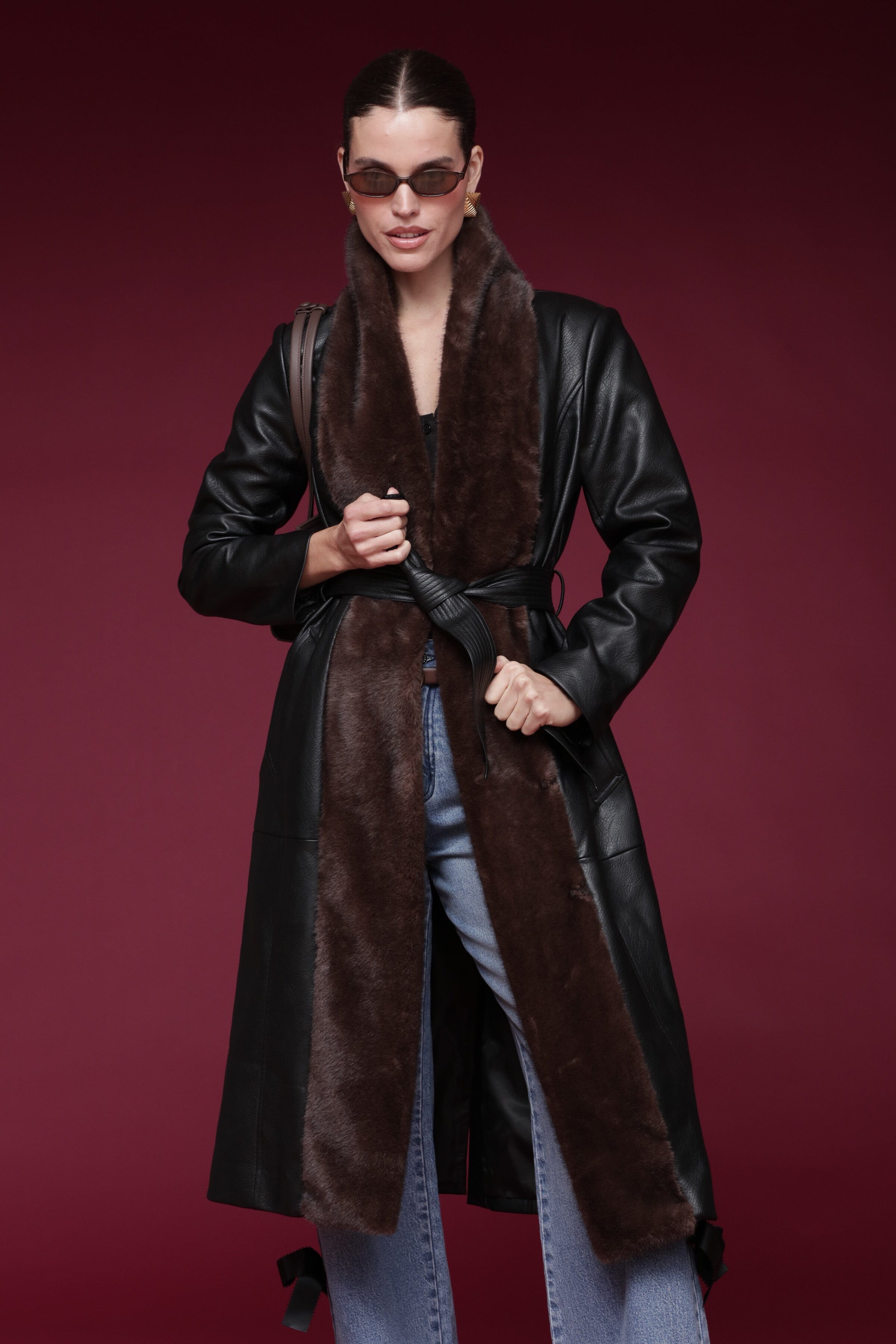 Fur-trimmed faux leather black wrap coat with a wide faux fur shawl collar, self-tie belt, and side pockets - Shop designer long wrap coats by Avec Les Filles