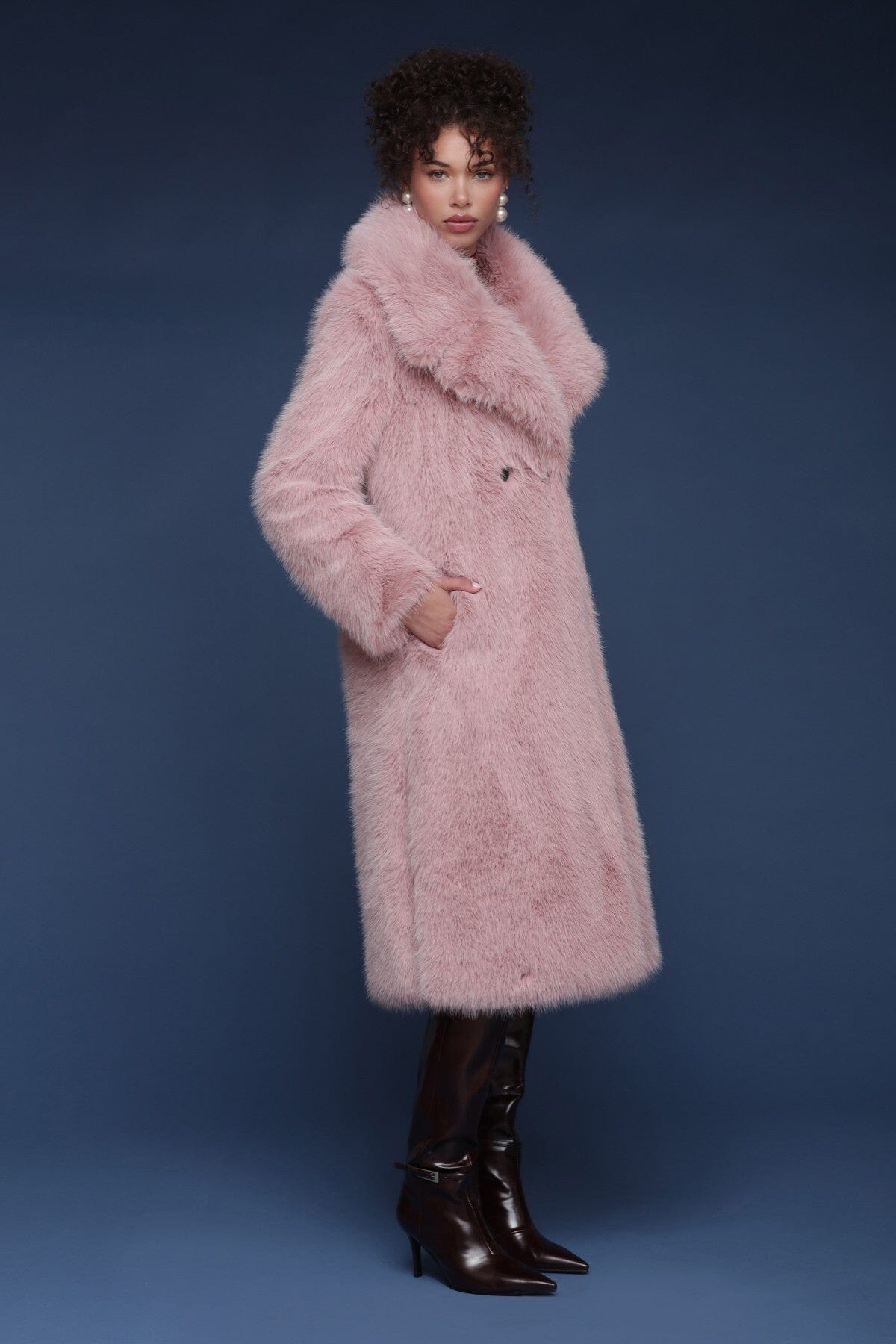 Oversized faux fur double-breasted pink midi coat with a wide notched lapel collar and side welt pockets - Shop designer women’s midi coats by Avec Les Filles.