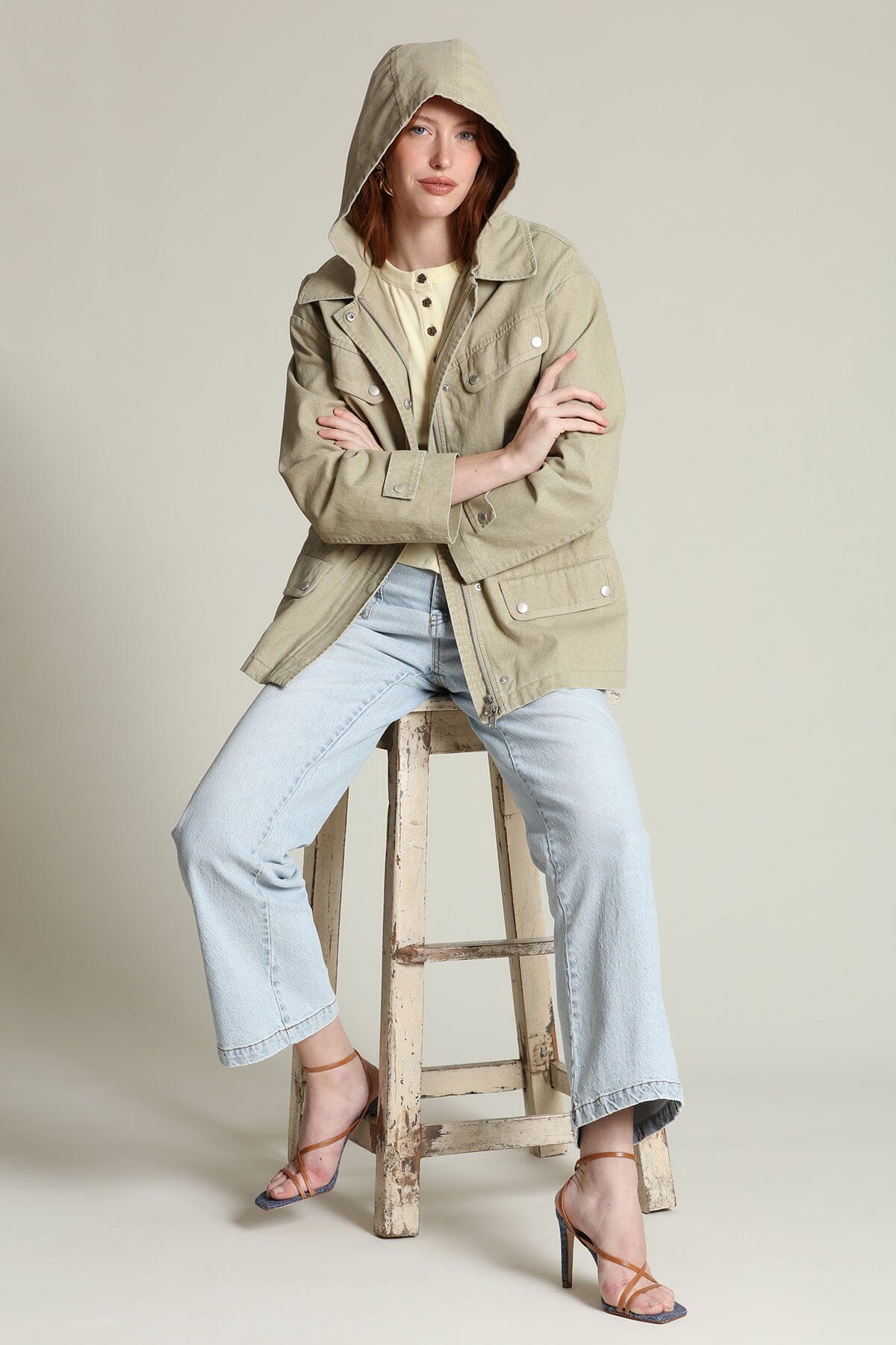 Cotton snap-front beige anorak jacket with long sleeves, attached hood, and an adjustable drawstring waist - Shop designer jackets by Avec Les Filles