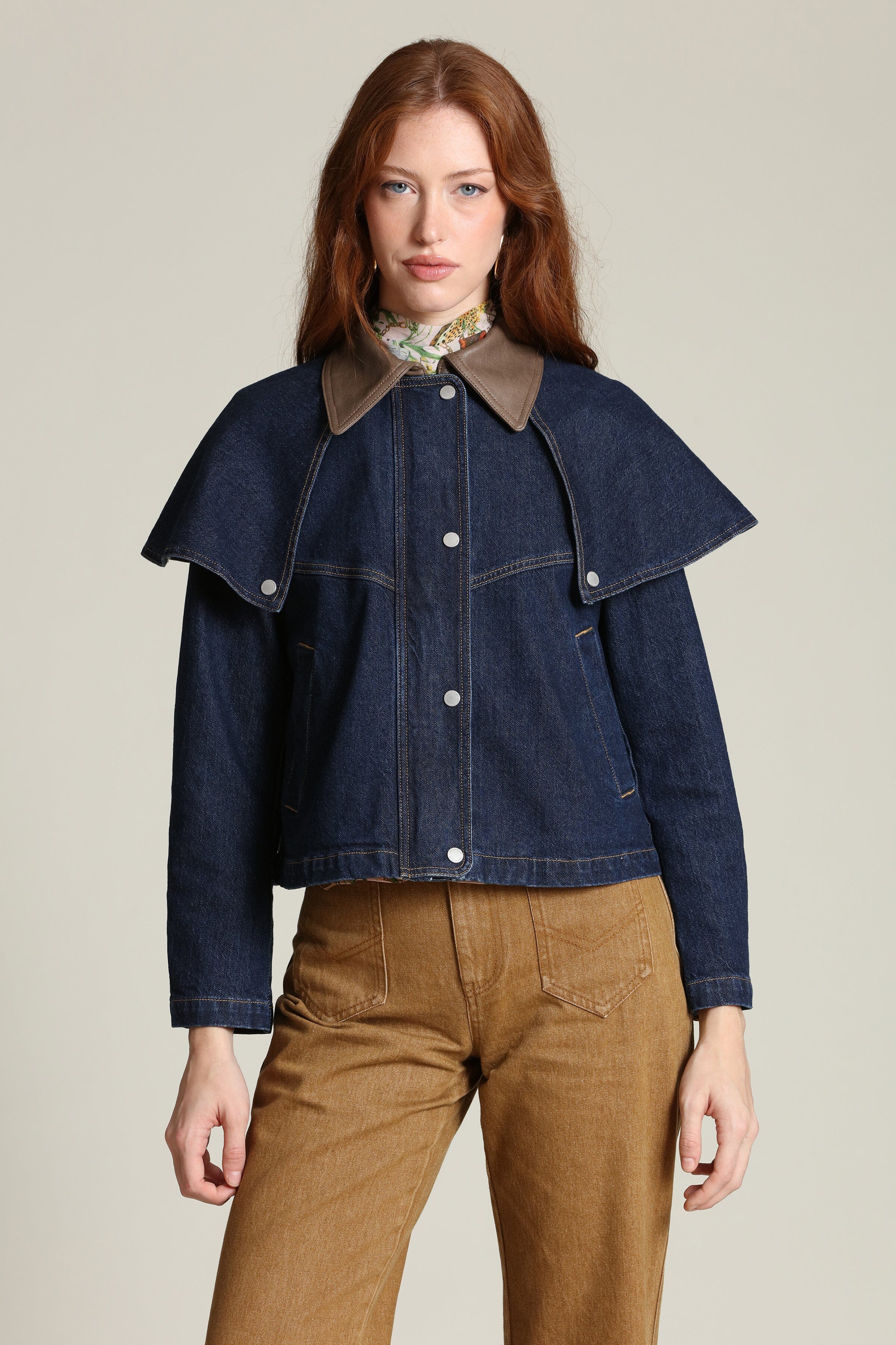 Denim cape cropped indigo blue jacket with snap-front and faux leather contrast collar by Avec Les Filles