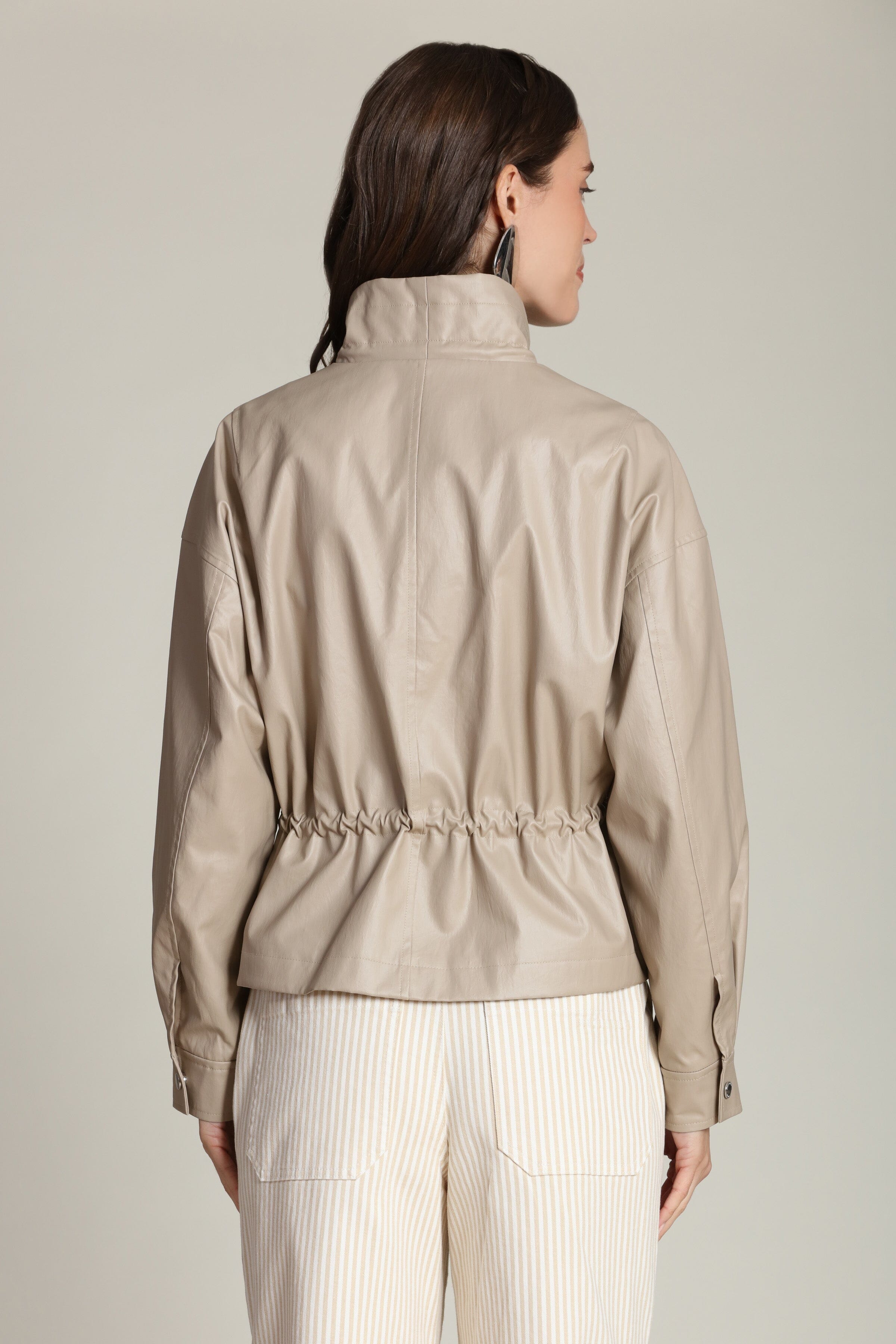 Faux leather cropped beige anorak jacket with snap-button front and adjustable drawstring by Avec Les Filles