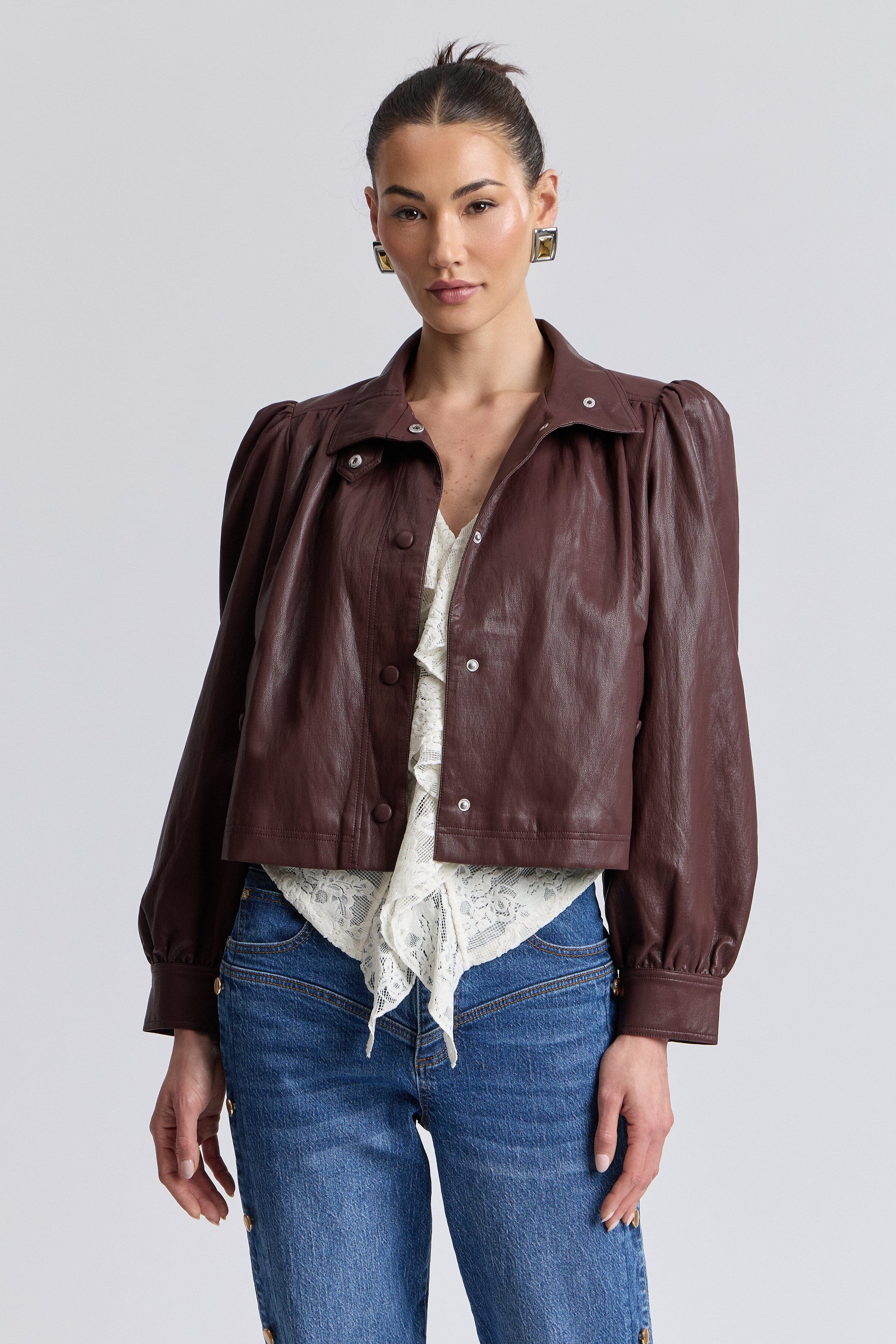 Puff-sleeve faux leather crop jacket with stand collar and welt pockets. Shop cute cropped jackets by Avec Les Filles.