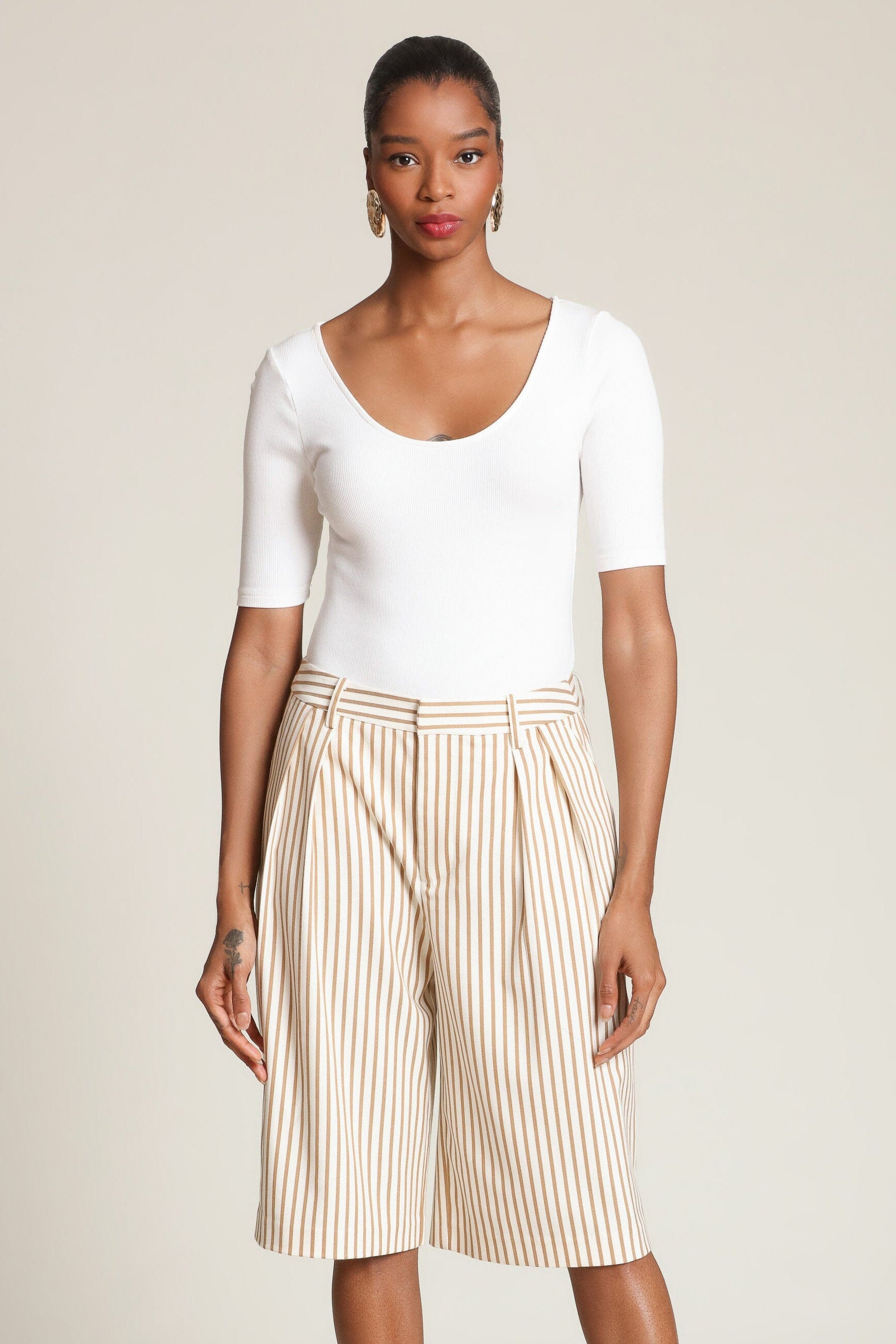 Striped boyfriend camel bermuda shorts with a high-rise waist, front pleats, and faux welt pockets - Shop designer women’s bermuda shorts by Avec Les Filles