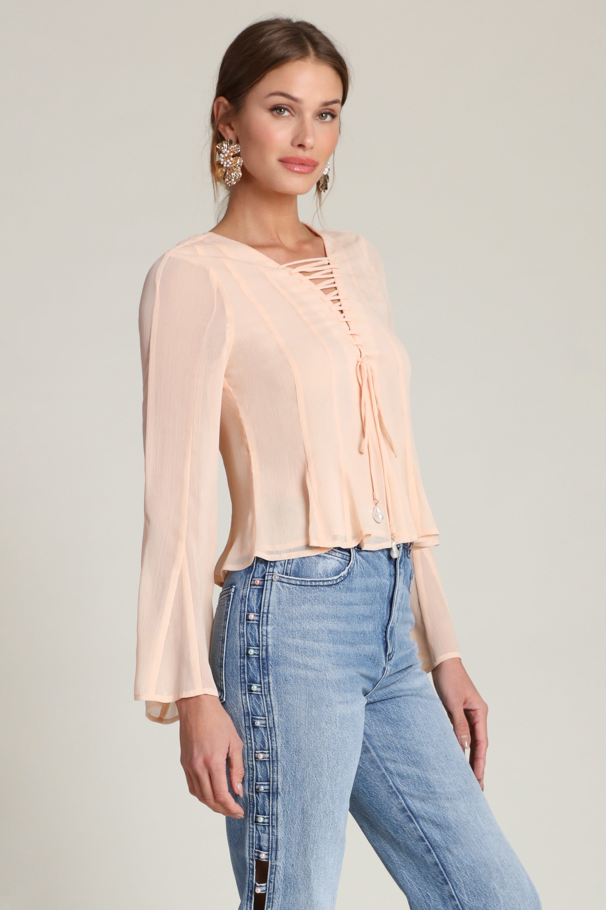 Lace-up peplum chiffon peach blouse with a V-neckline and long flared sleeves - Shop designer women’s chiffon blouses by Avec Les Filles