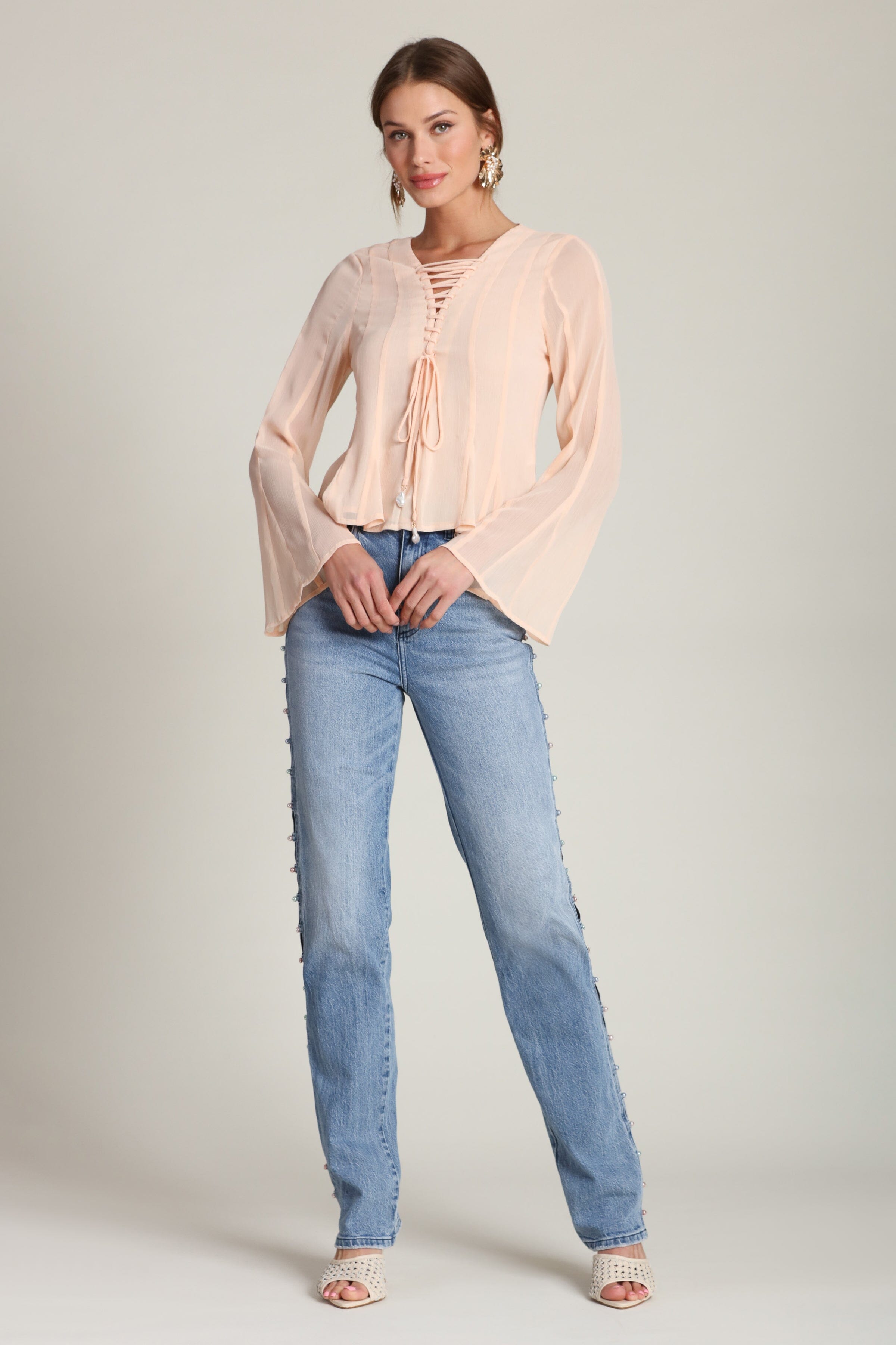 Lace-up peplum chiffon peach blouse with a V-neckline and long flared sleeves - Shop designer women’s chiffon blouses by Avec Les Filles