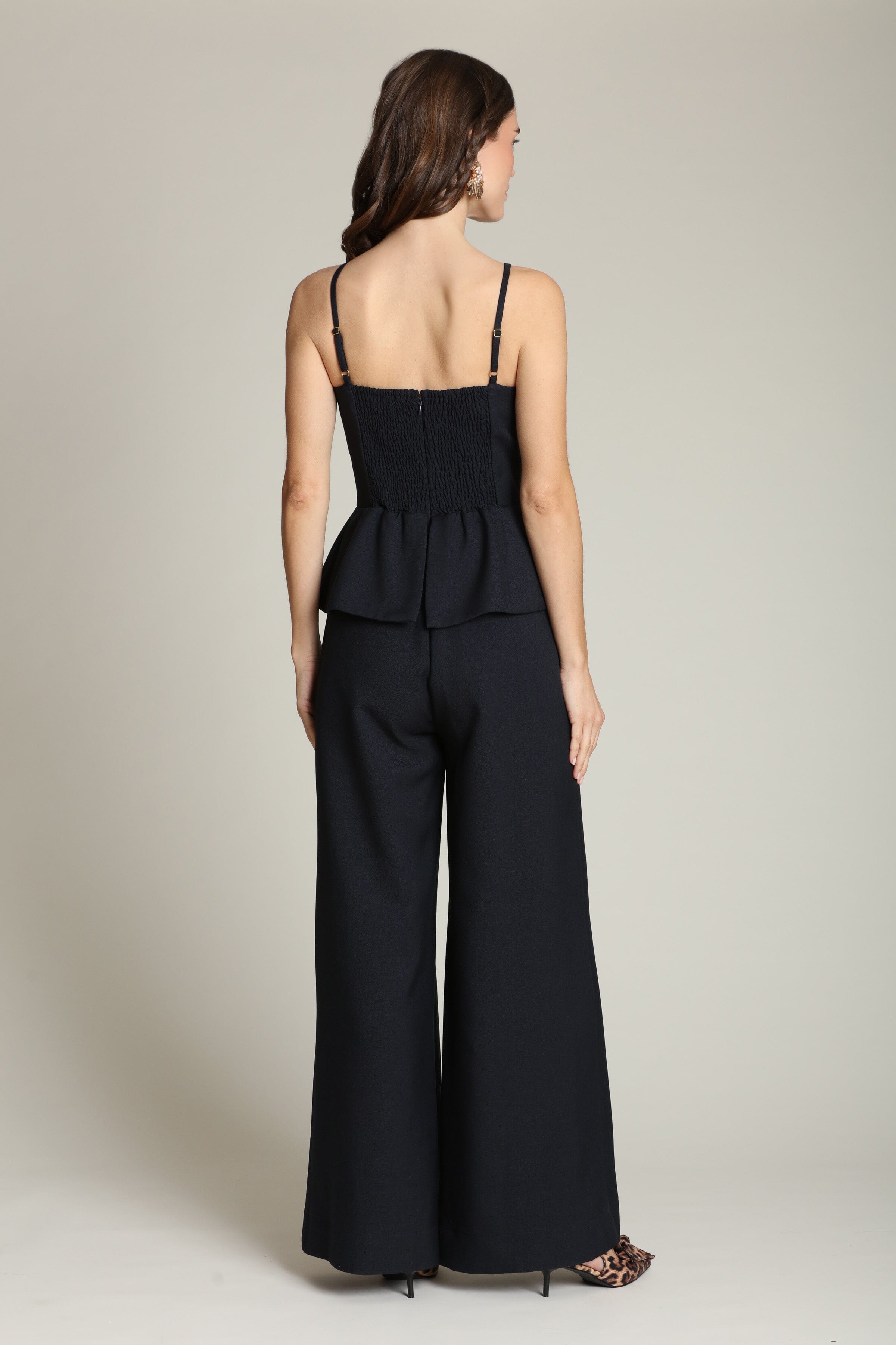 Peplum wide-leg navy jumpsuit with adjustable spaghetti straps by Avec Les Filles