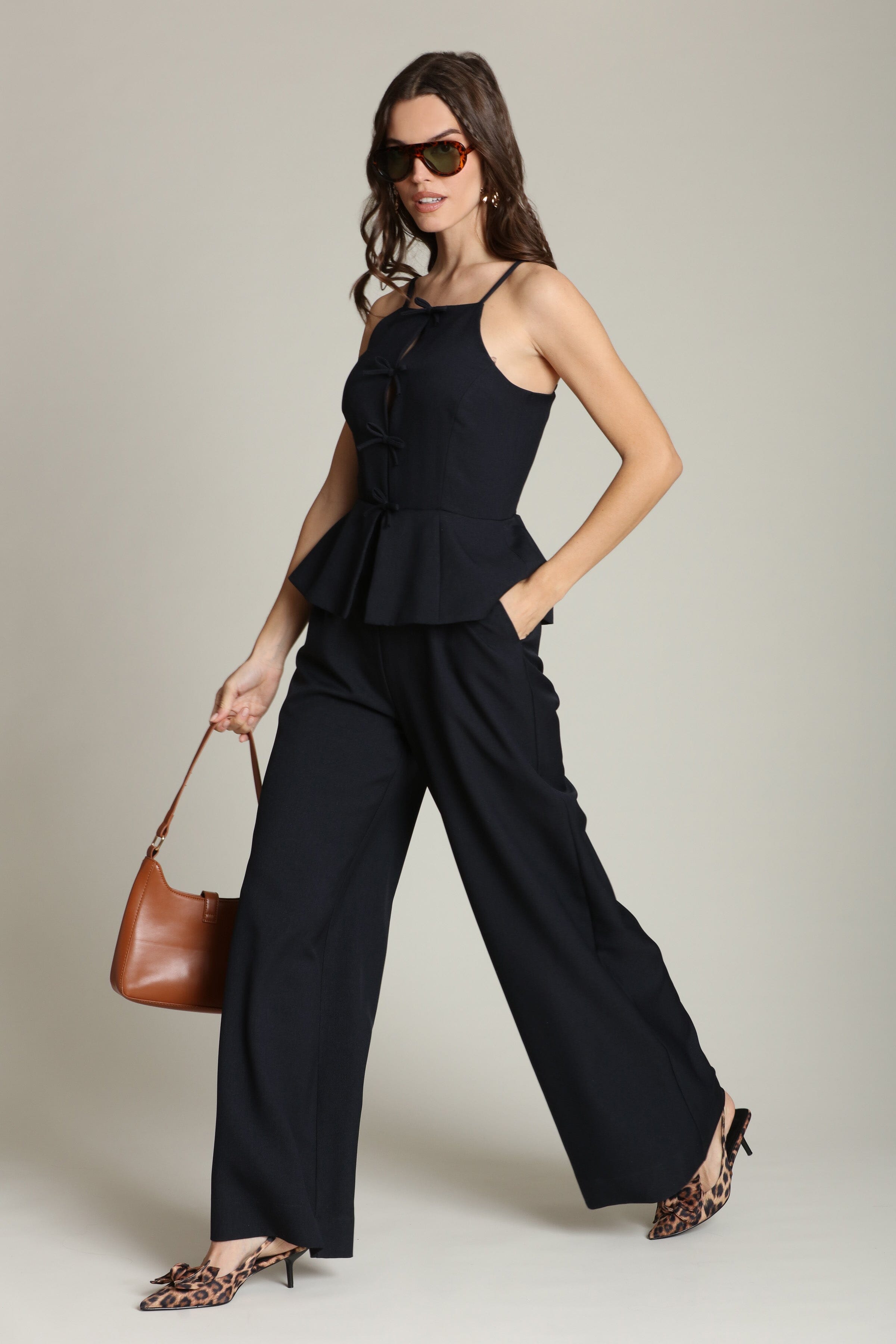Peplum wide-leg navy jumpsuit with adjustable spaghetti straps and a front tie-front - Shop women's designer jumpsuits by Avec Les Filles