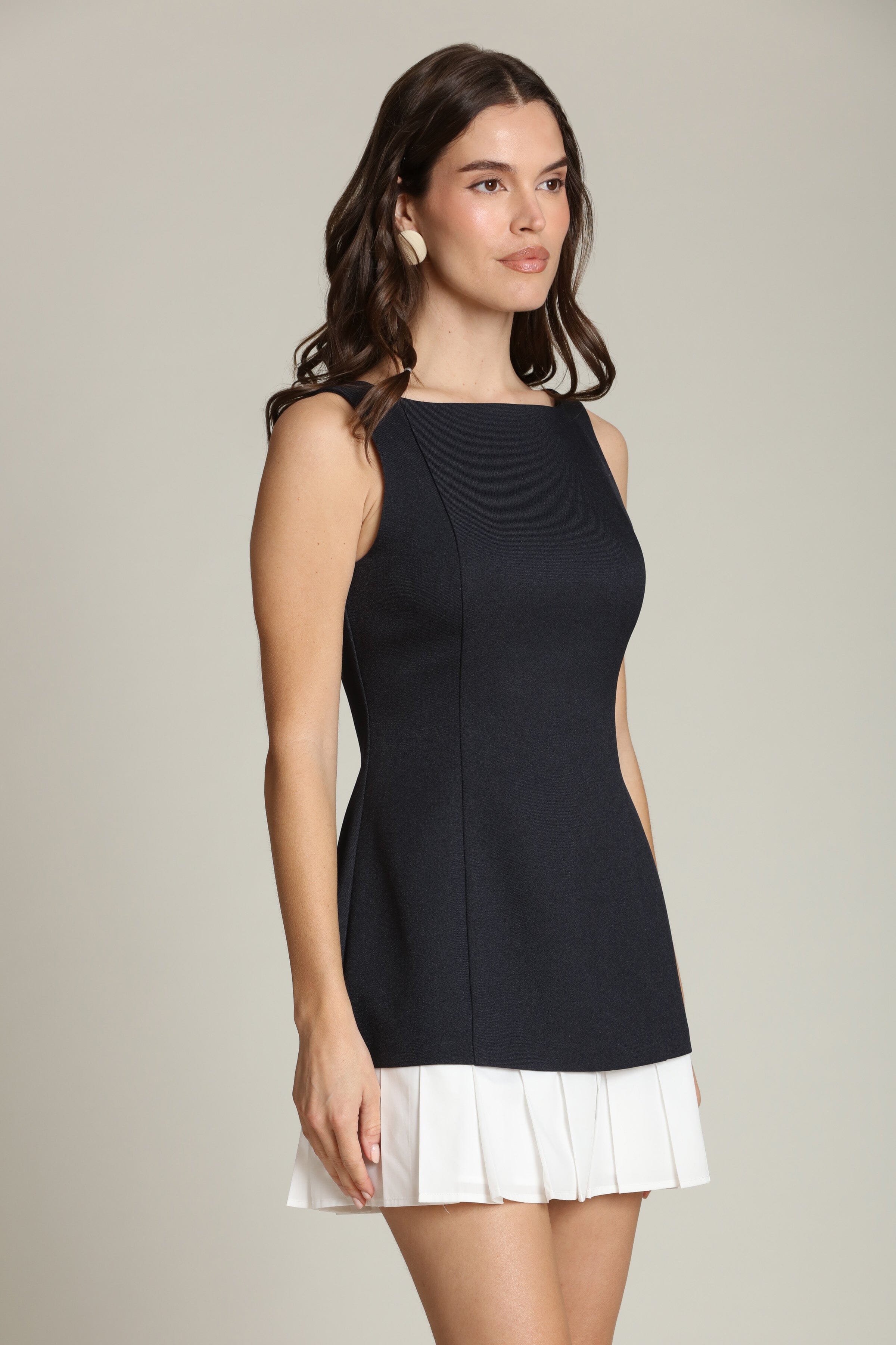 Contrast pleated navy and white mini dress with a sleeveless silhouette and bateau neckline - Shop women's mini dresses by Avec Les Filles