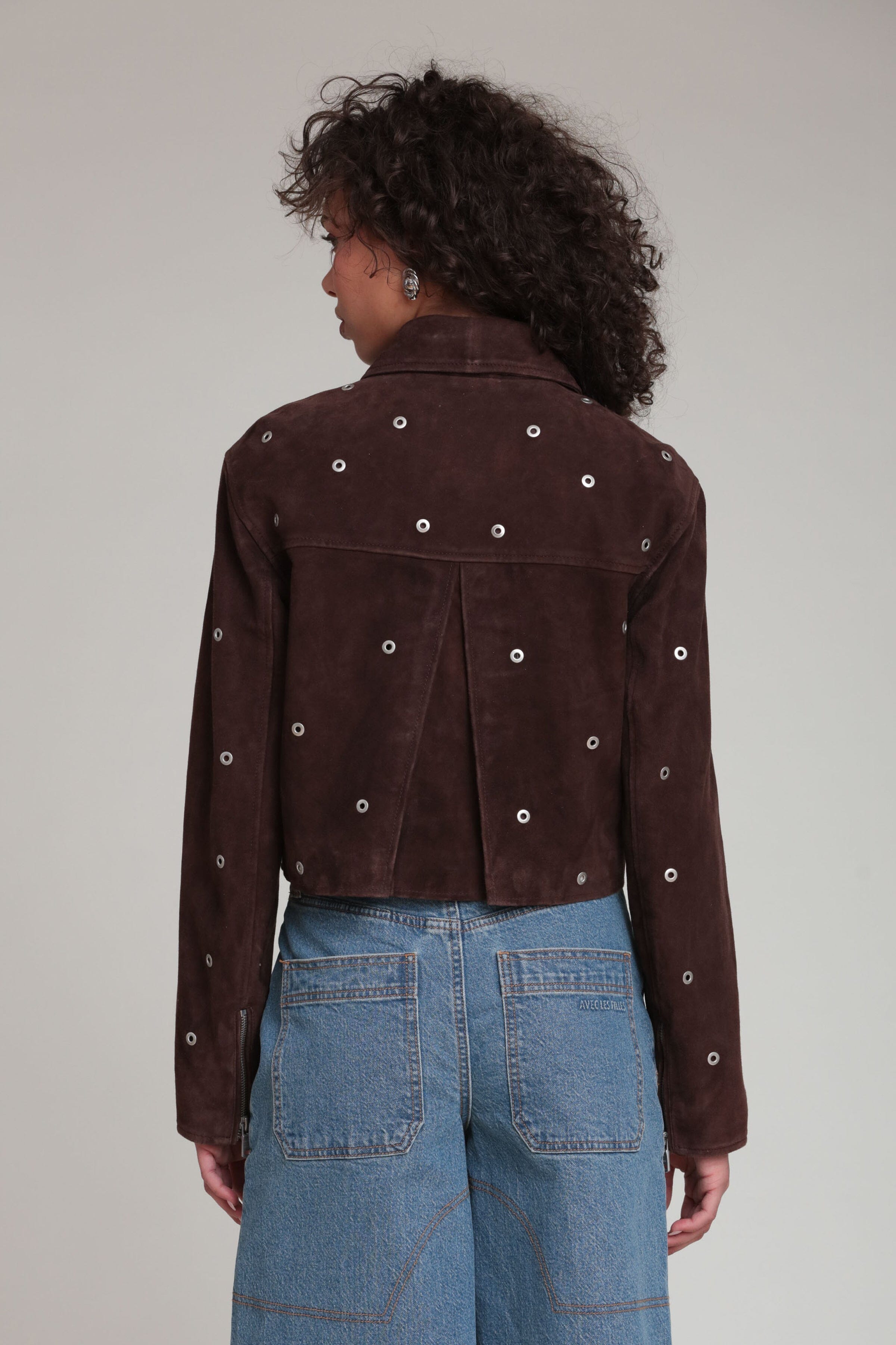 Genuine suede grommet-studded cropped dark brown jacket with a pointed collar and shoulder pads by Avec Les Filles