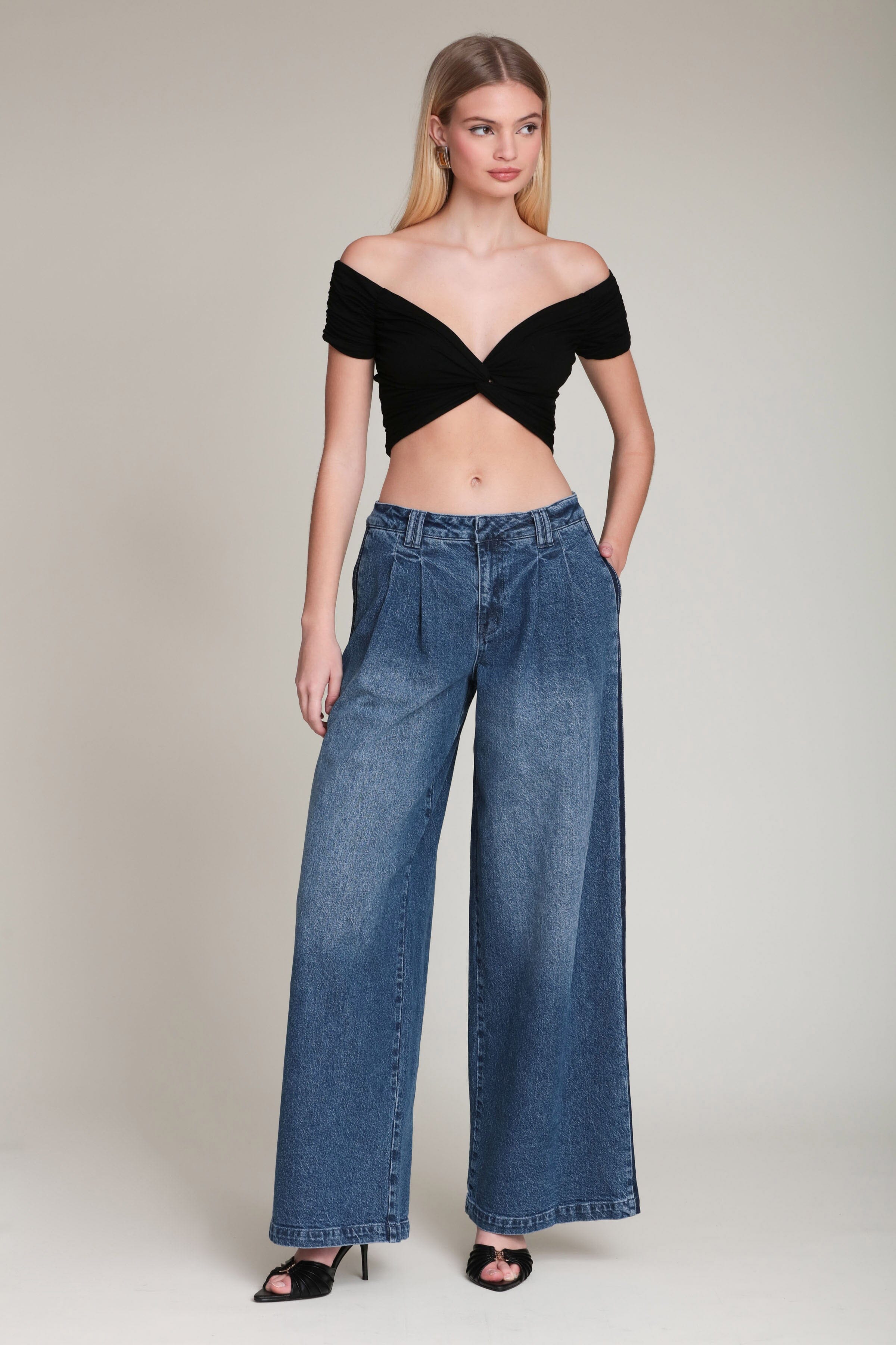 Side stripe wide-leg dark blue wash denim jeans in cotton blend with mid-rise waist and front pleats by Avec Les Filles