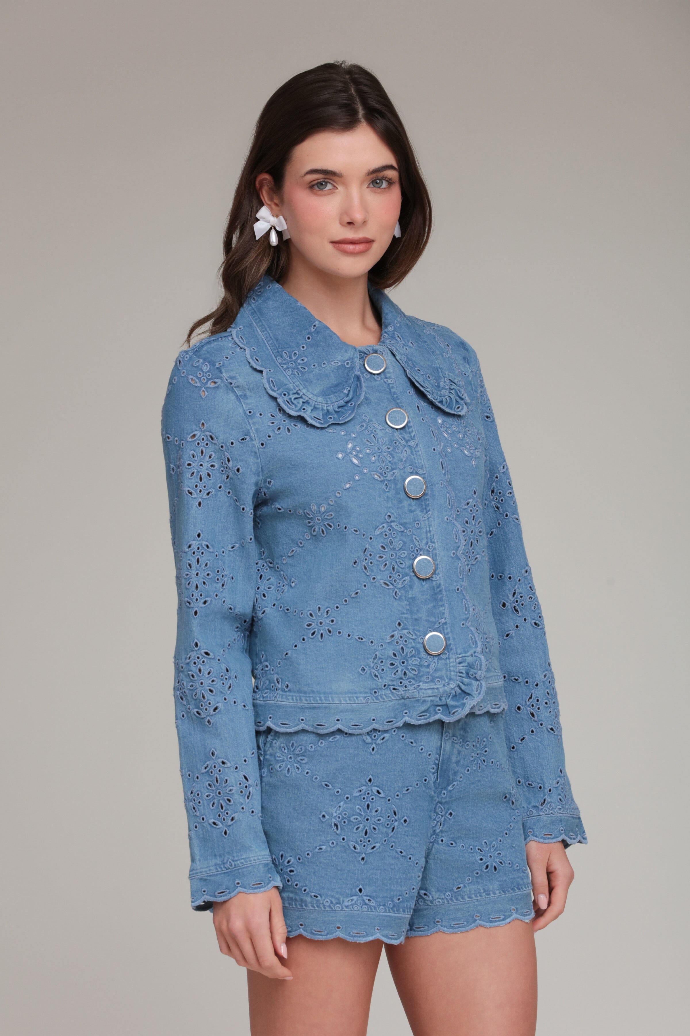 Embroidered blue cropped denim jacket in cotton with high rise denim shorts by Avec Les Filles