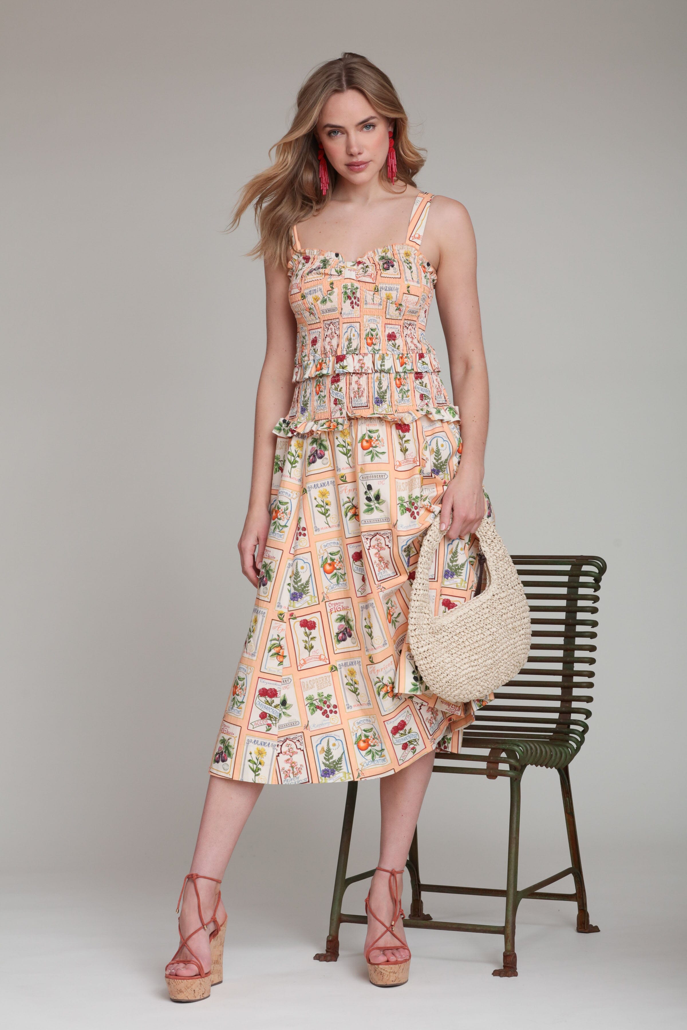 Cotton smocked peach floral midi dress with adjustable shoulder straps and sweetheart neck by Avec Les Filles