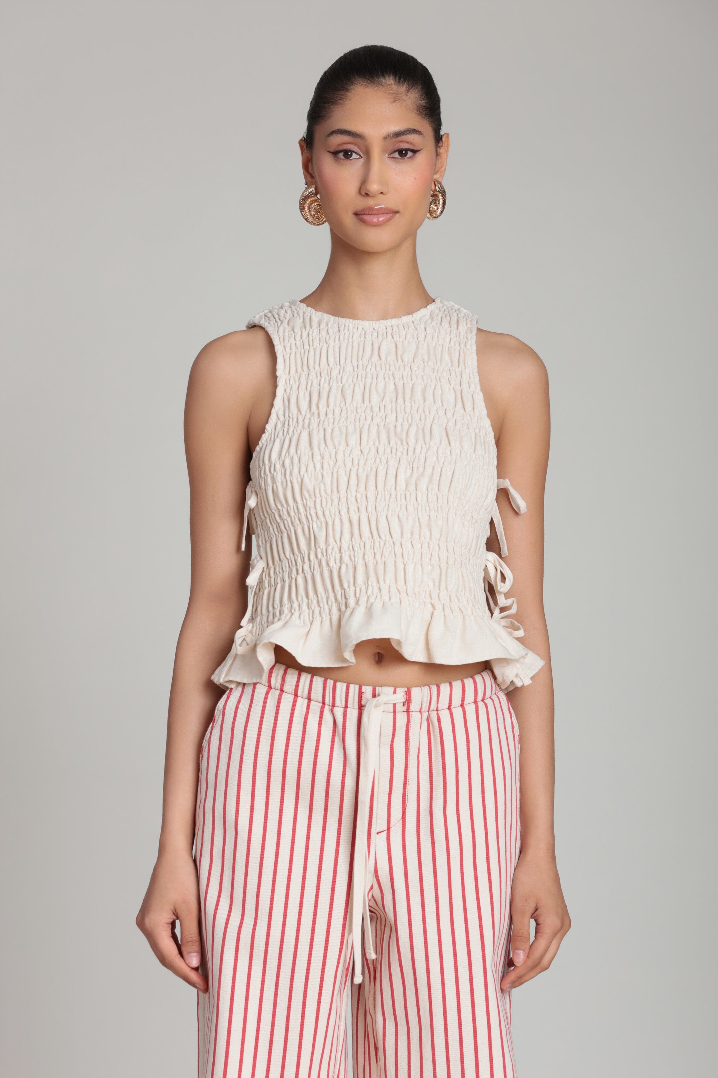Linen blend side-tie sleeveless cream ruffle top with smocked bodice. Shop smocked top womens by Avec Les Filles. 
