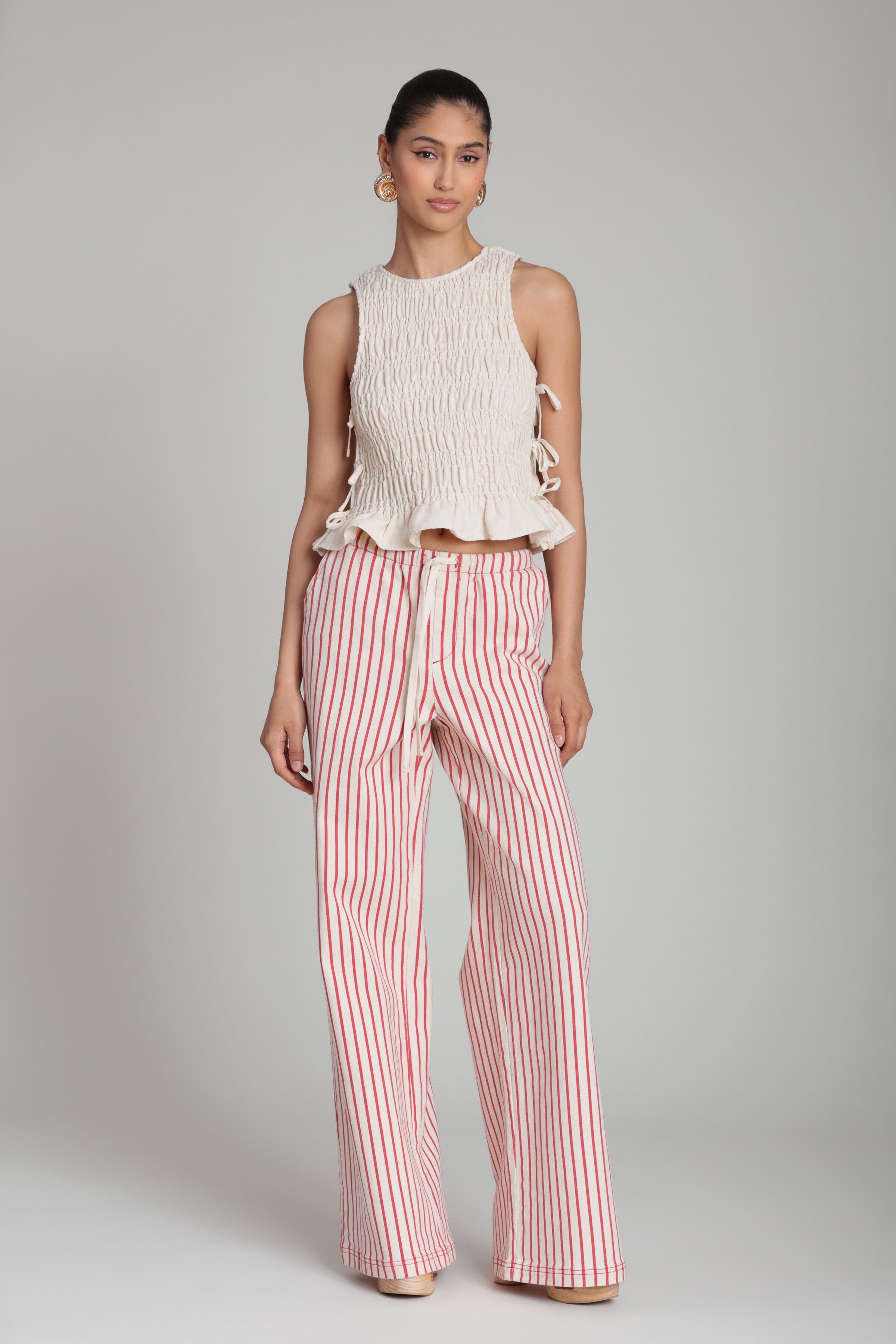 Linen blend side-tie sleeveless cream ruffle top with smocked bodice. Shop smocked top womens by Avec Les Filles. 