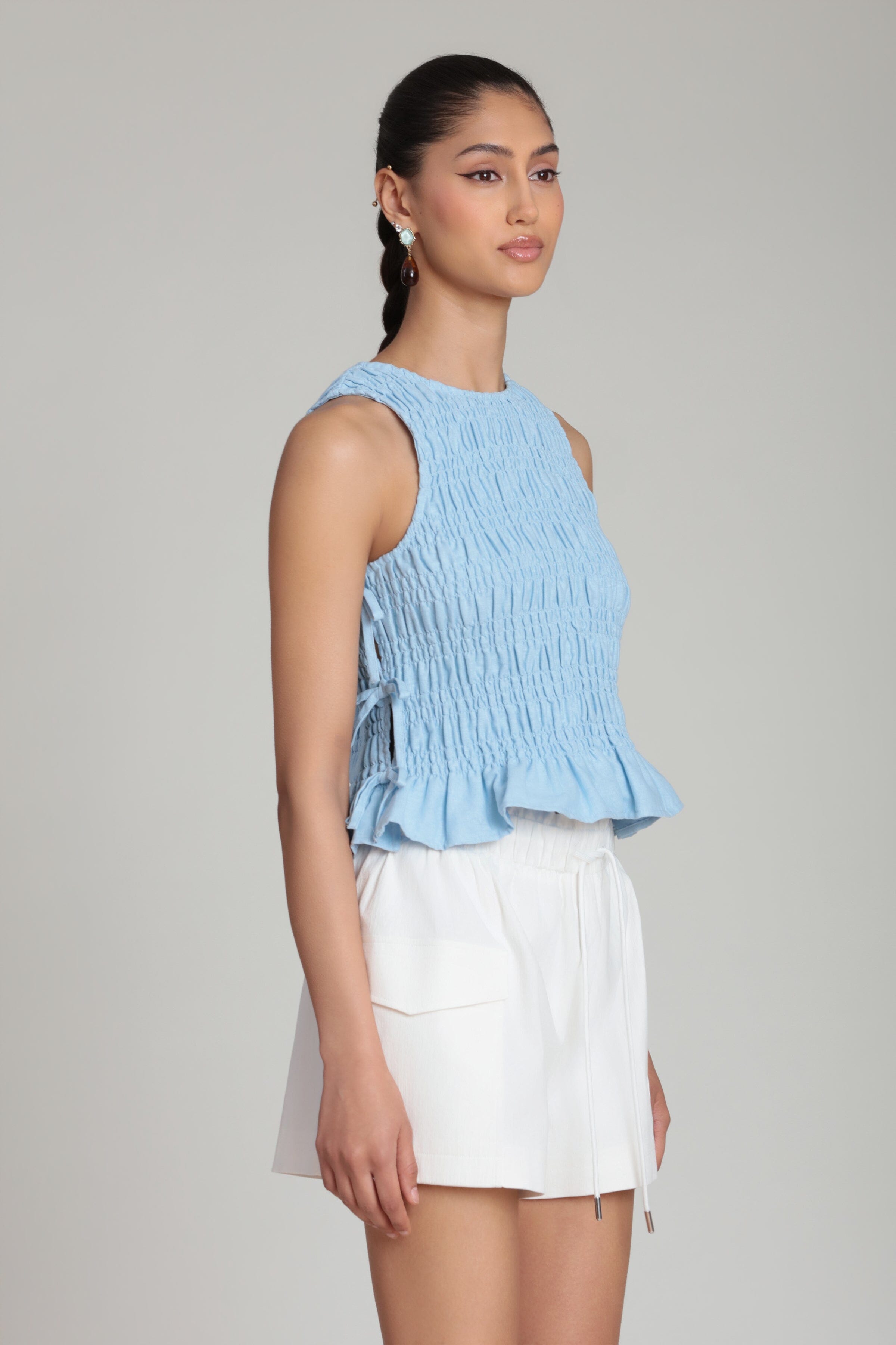 Linen blend sleeveless tie side tank top with smocked bodice - Shop women's cute ruffle tops by Avec Les Filles.