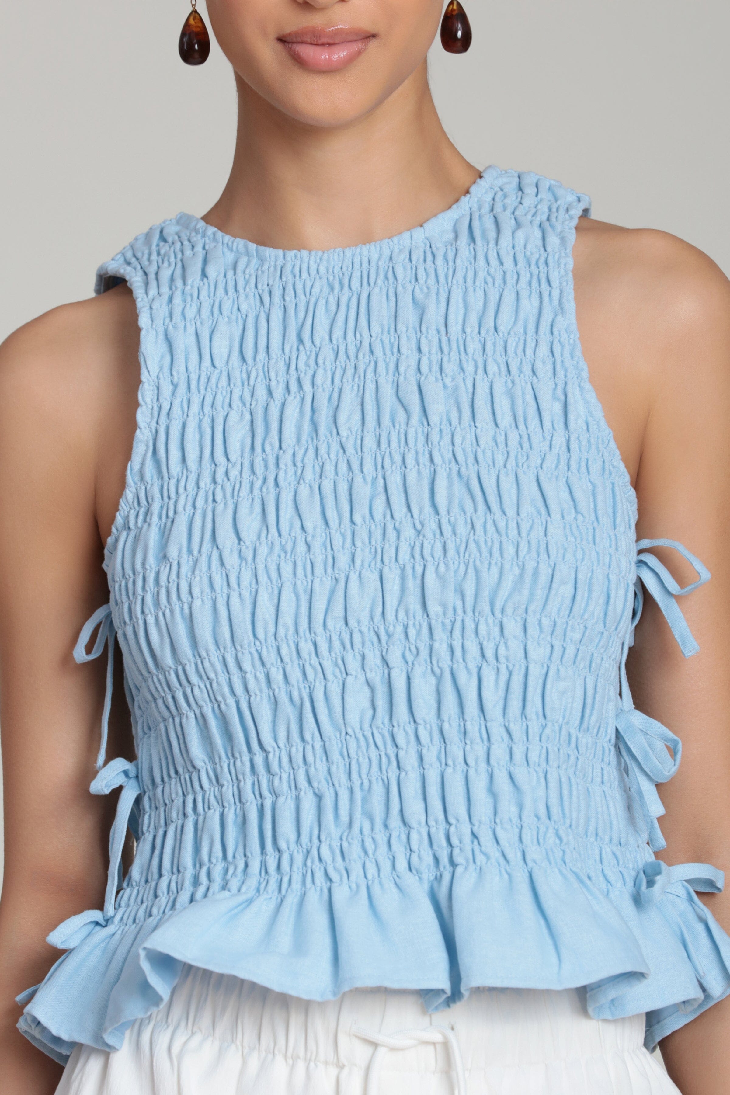 sleeveless blue high neck tank tops with smocked bodice - Shop women's cute ruffle tops by Avec Les Filles.