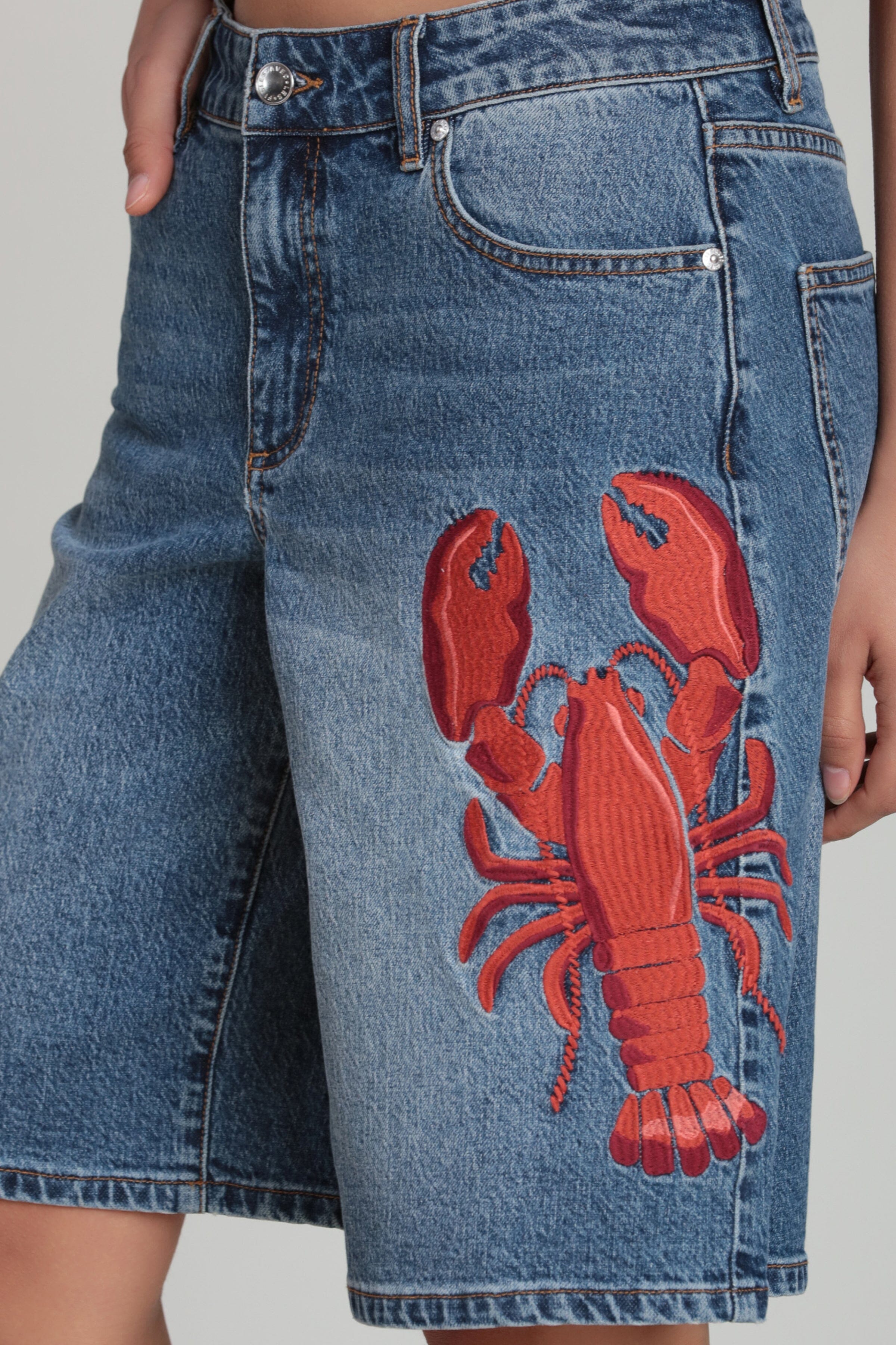 Blue embroidered denim shorts in cotton blend with lobster embroidery - Shop women's denim shorts by Avec Les Filles