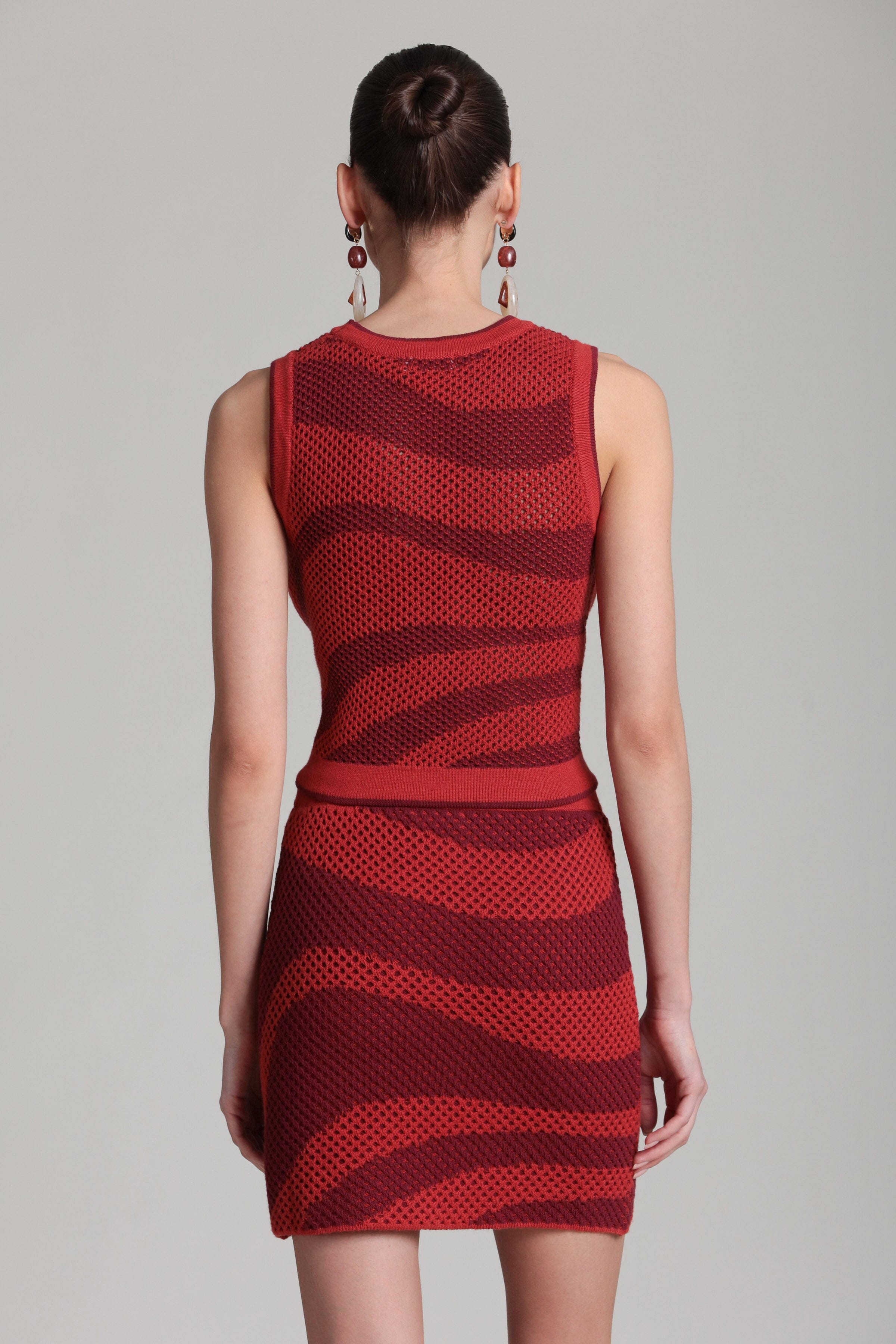 Sleeveless red mesh tank top with crew neckline. Shop designer women's mesh tops by Avec Les Filles.