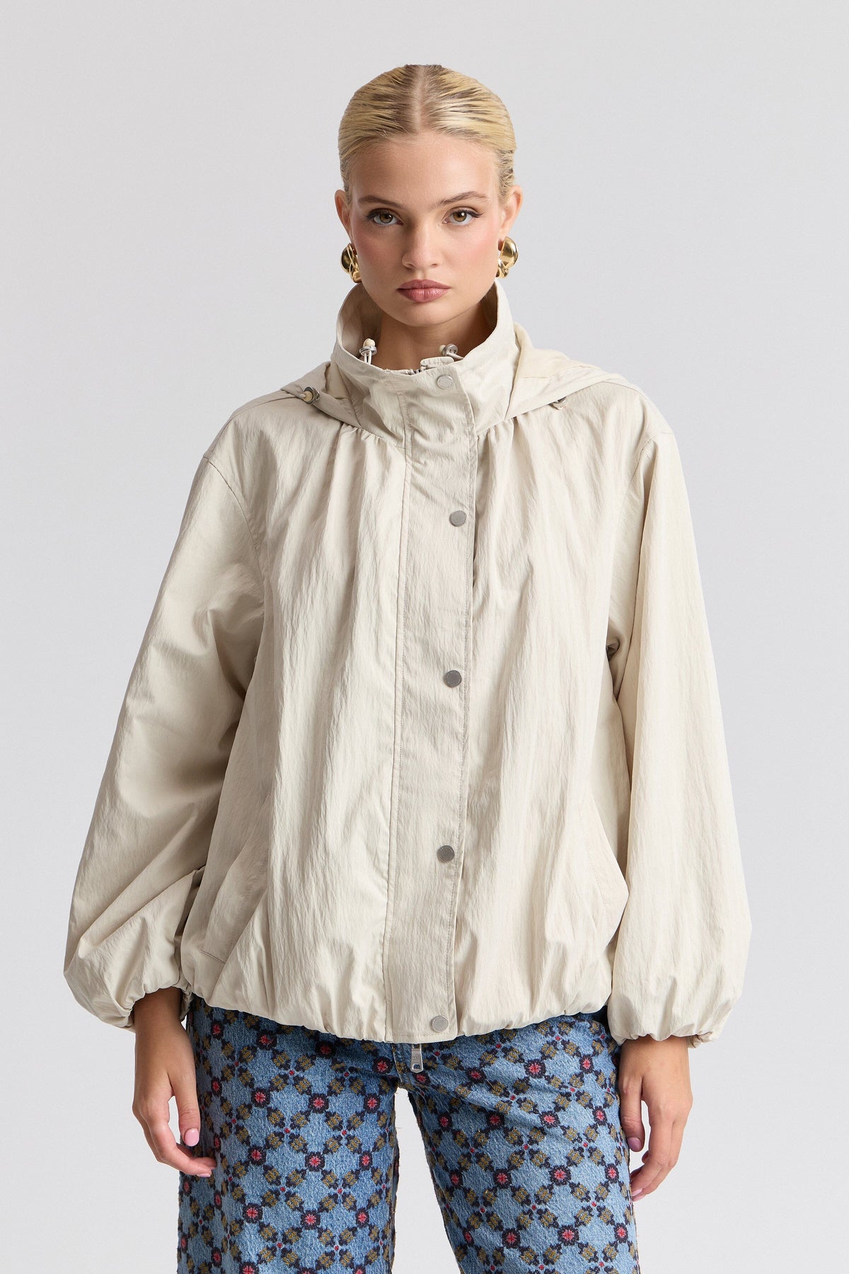 Nylon-blend womens windbreaker jacket with balloon sleeves. Shop designer white jackets by Avec Les Filles.