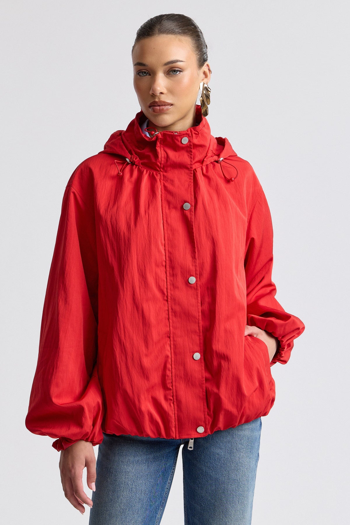 Red women's windbreaker jacket with balloon sleeves. Shop designer red jackets by Avec Les Filles.