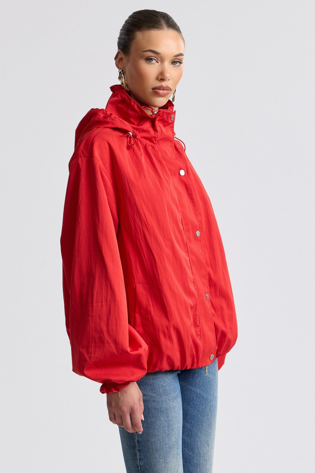 Hooded windbreaker red jacket with balloon sleeves. Shop designer women's cute red jackets by Avec Les Filles.
