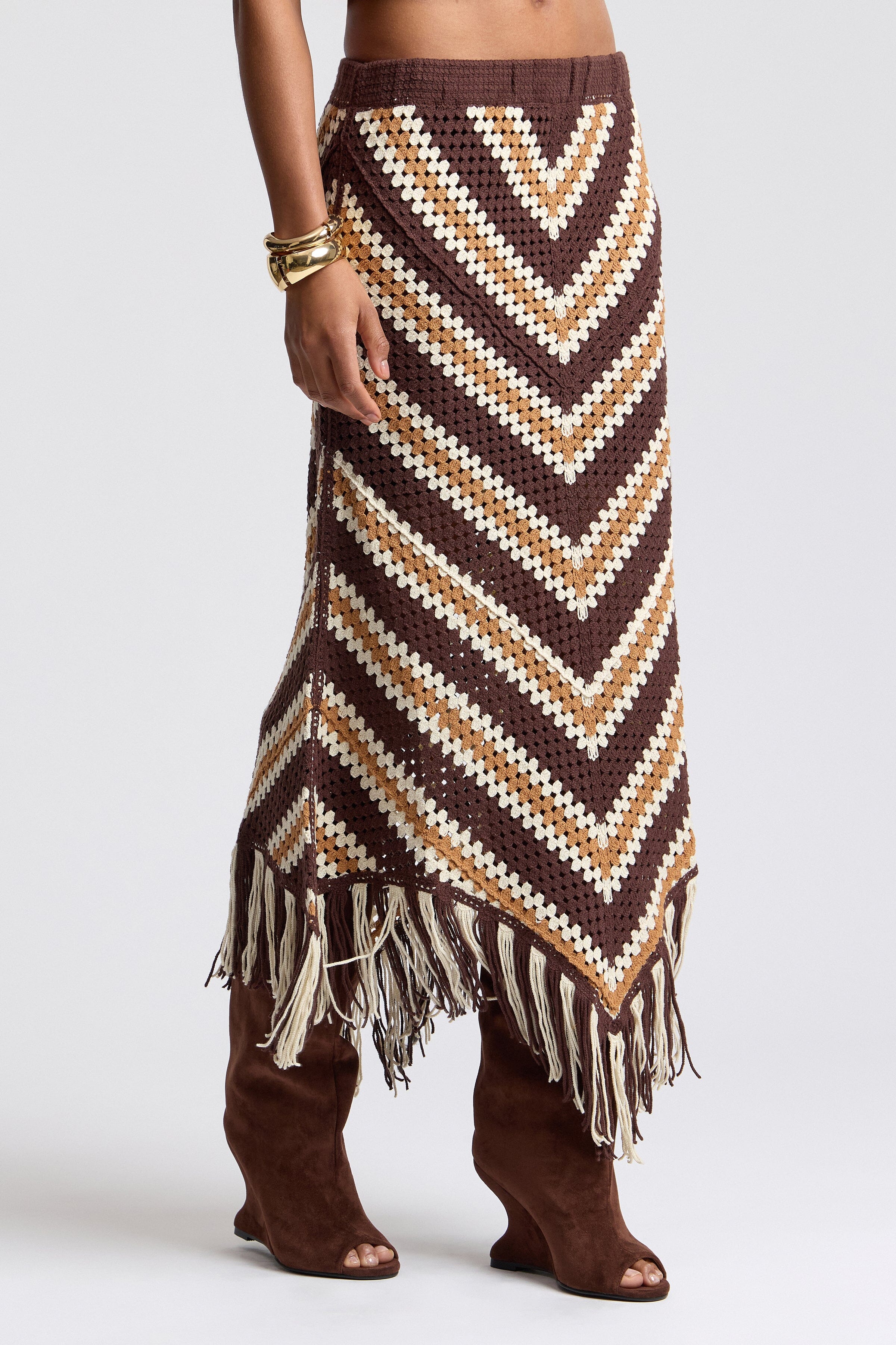 Brown crochet skirt with an elastic waist and swingy fringe. Shop women's cute maxi skirts by Avec Les Filles