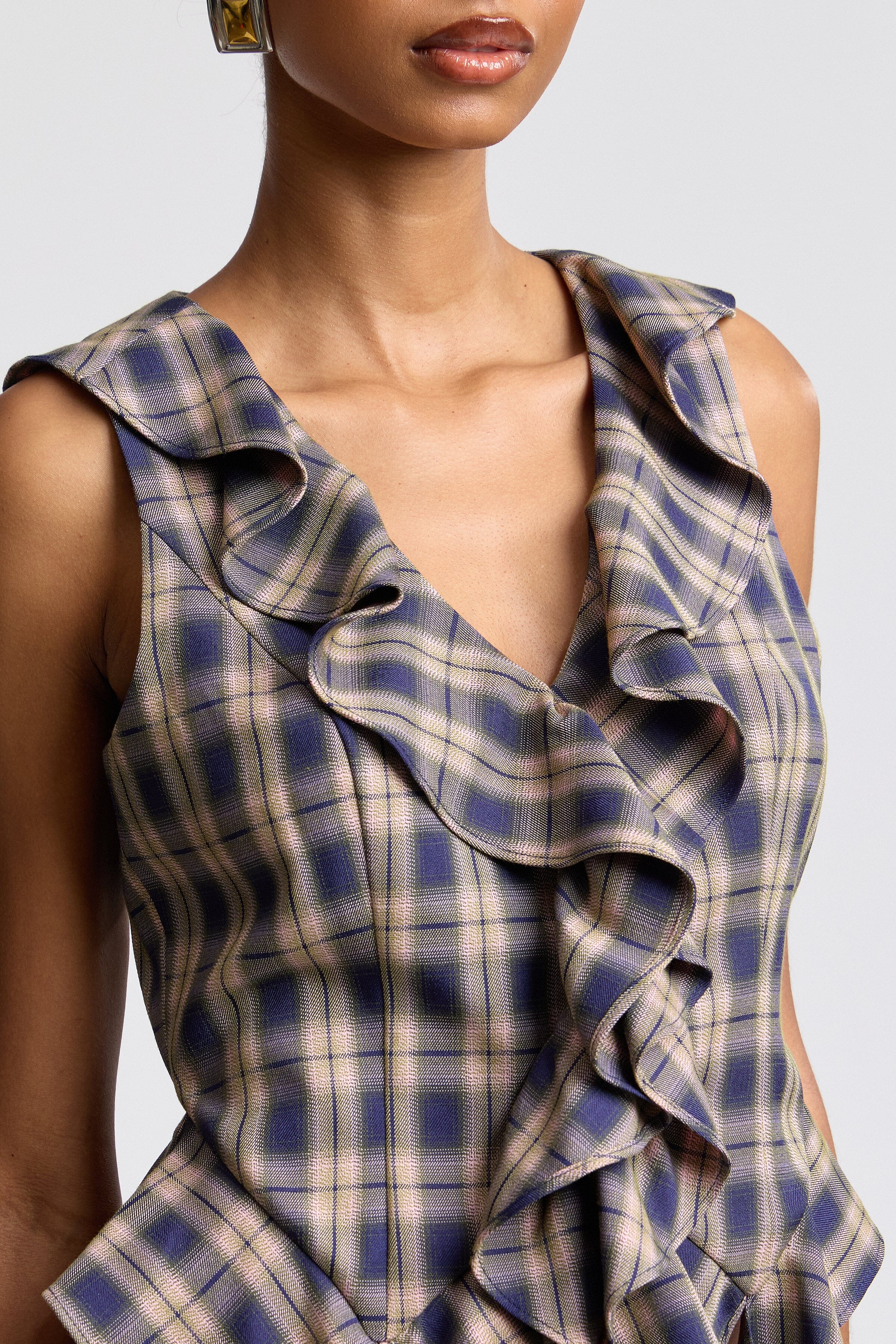 Twilight navy and taupe sleeveless ruffle top. Shop designer women's fitted tops by Avec Les Filles. 