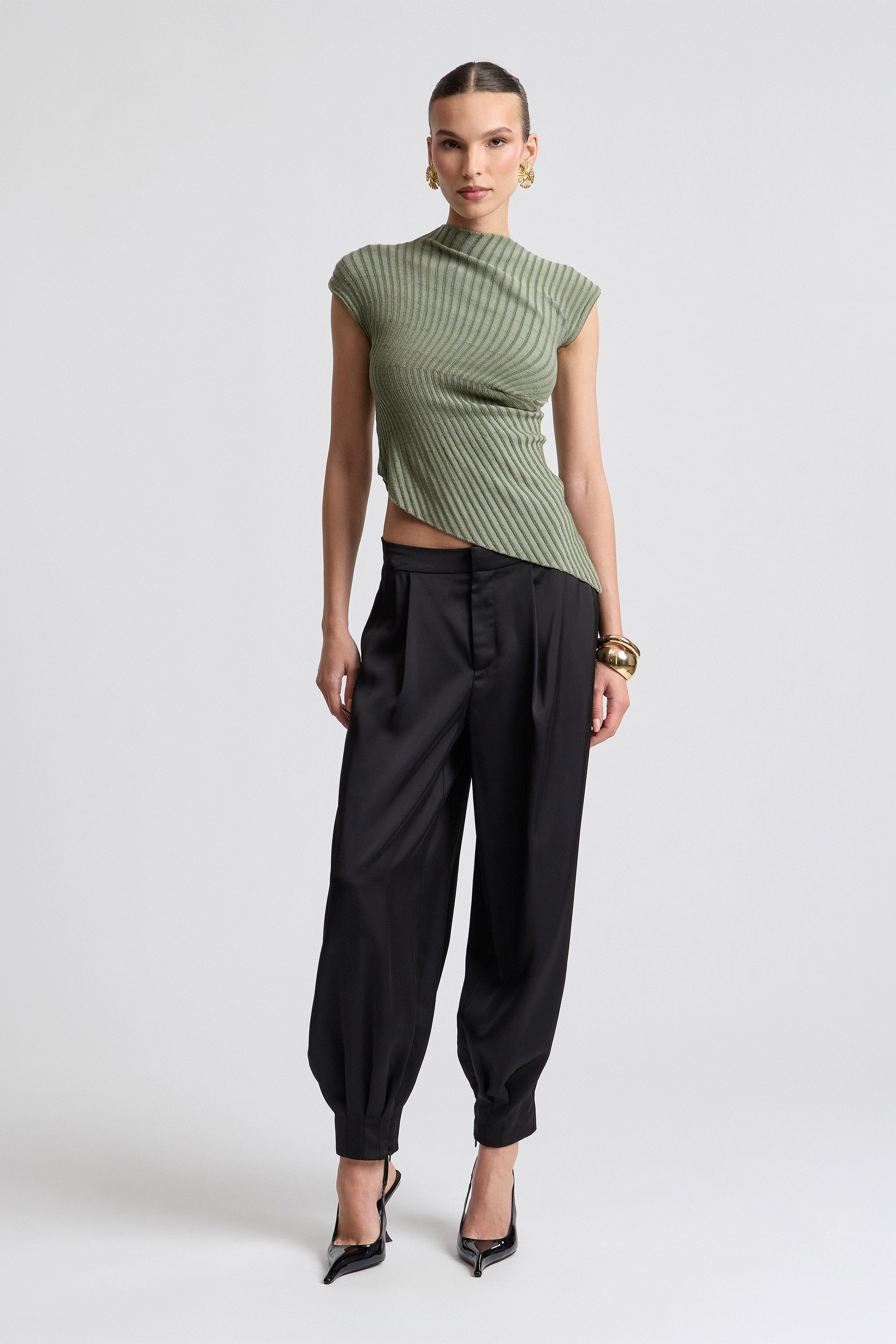 Black pleated satin balloon leg pants. Shop designer women's pants by Avec Les Filles.