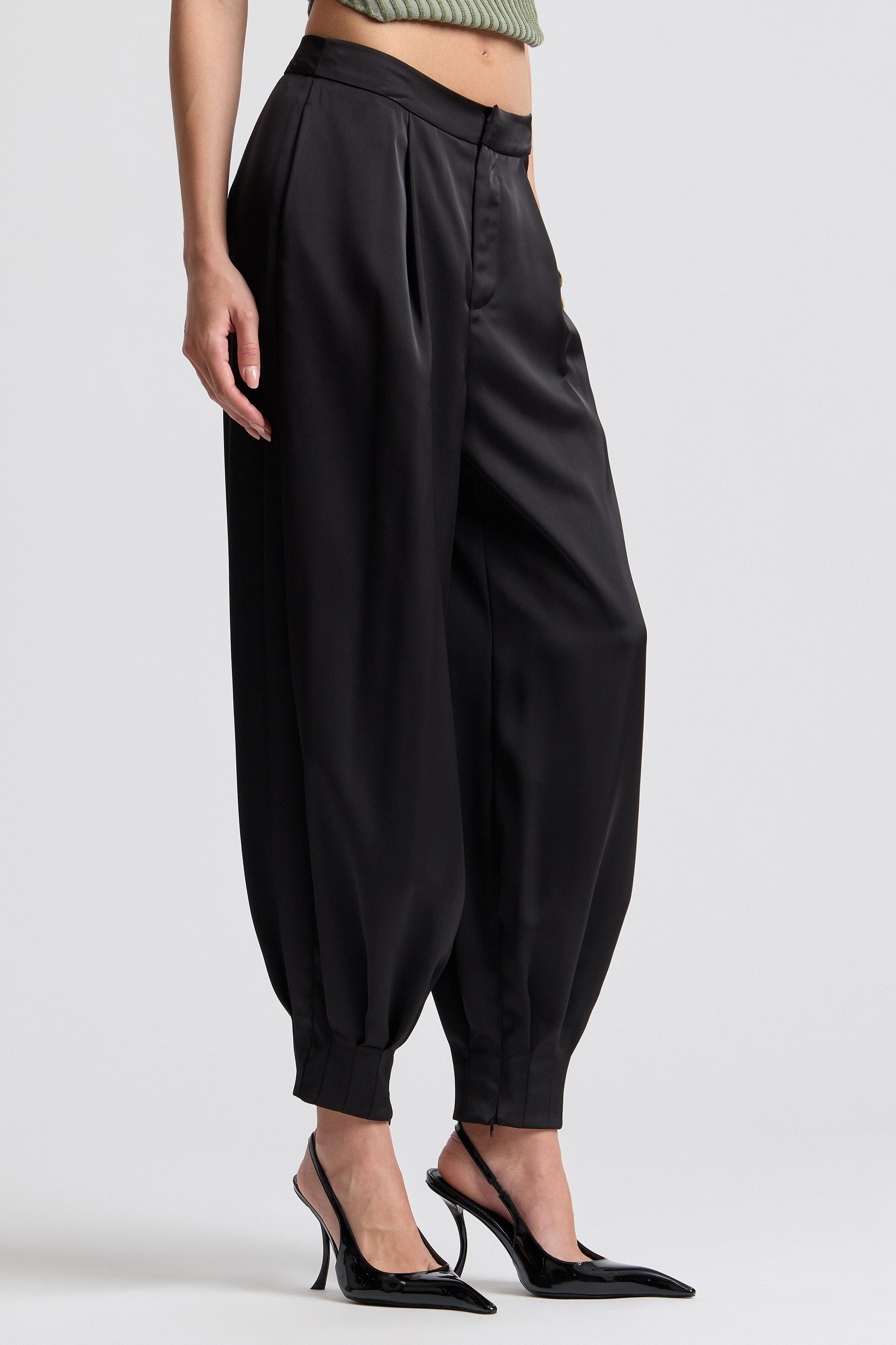 Black pleated satin pants. Shop designer women's cute satin pants by Avec Les Filles.