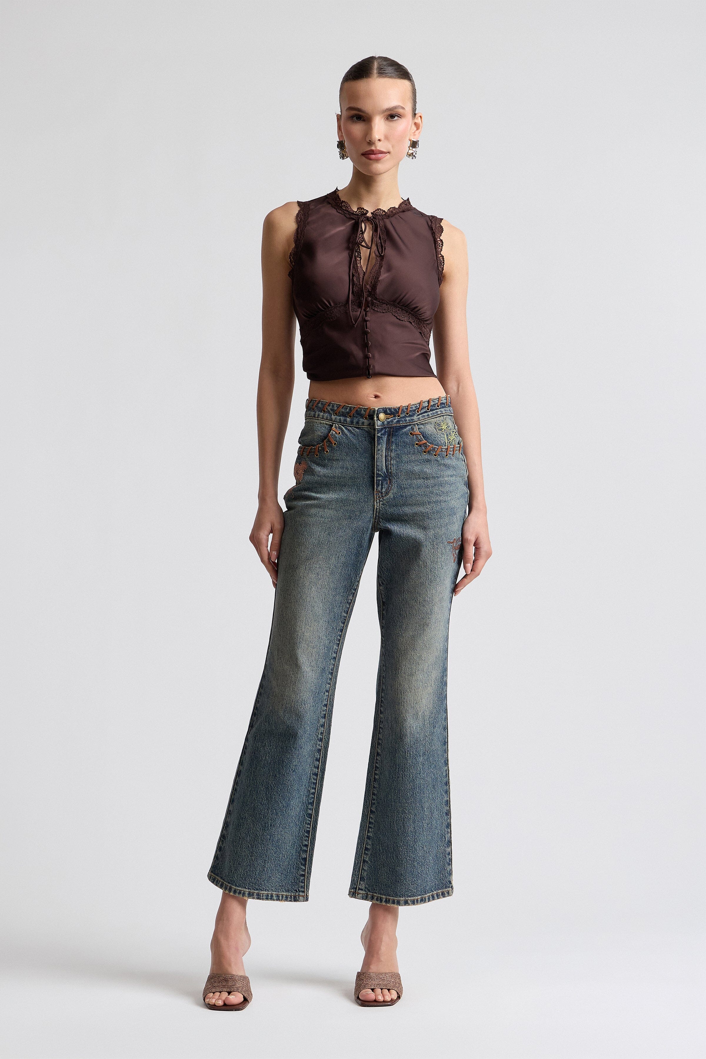 Vintage-inspired 70's style jeans with embroidered denim - Shop designer women's high-rise flared denim jeans.