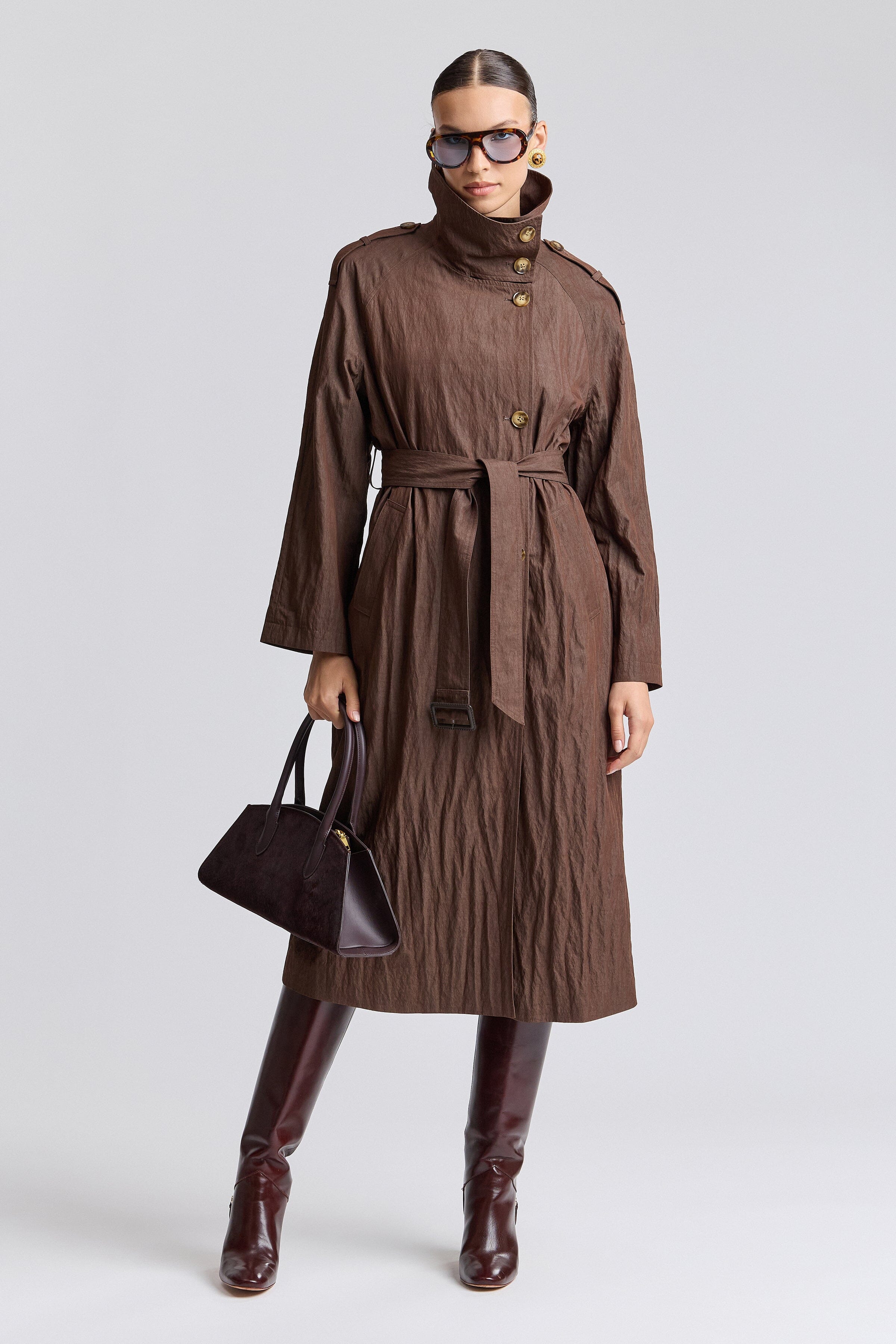 Maxi brown trench coat is crafted from lightweight crinkle fabric with a modern, relaxed structure by Avec Les Filles.