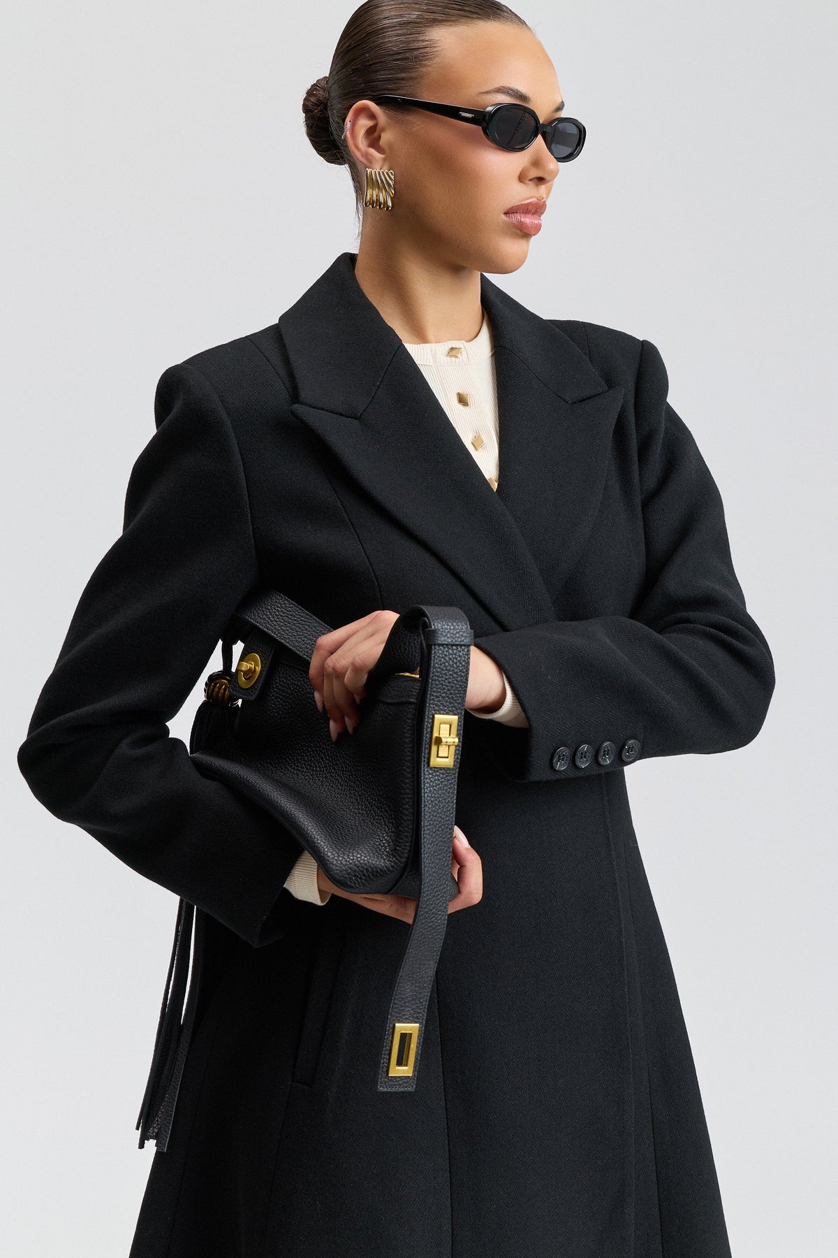 Fit-and-flare long back coat women in wool blend with a button- front - Shop designer black coats by Avec Les Filles.