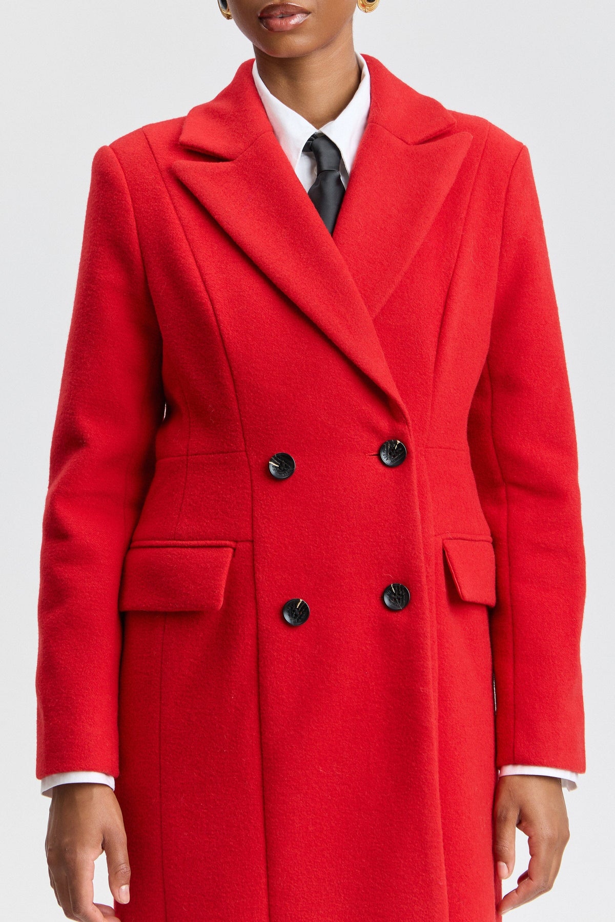 Double-breasted coat red with a notched lapel collar. Shop designer women's long coats by Avec Les Filles.