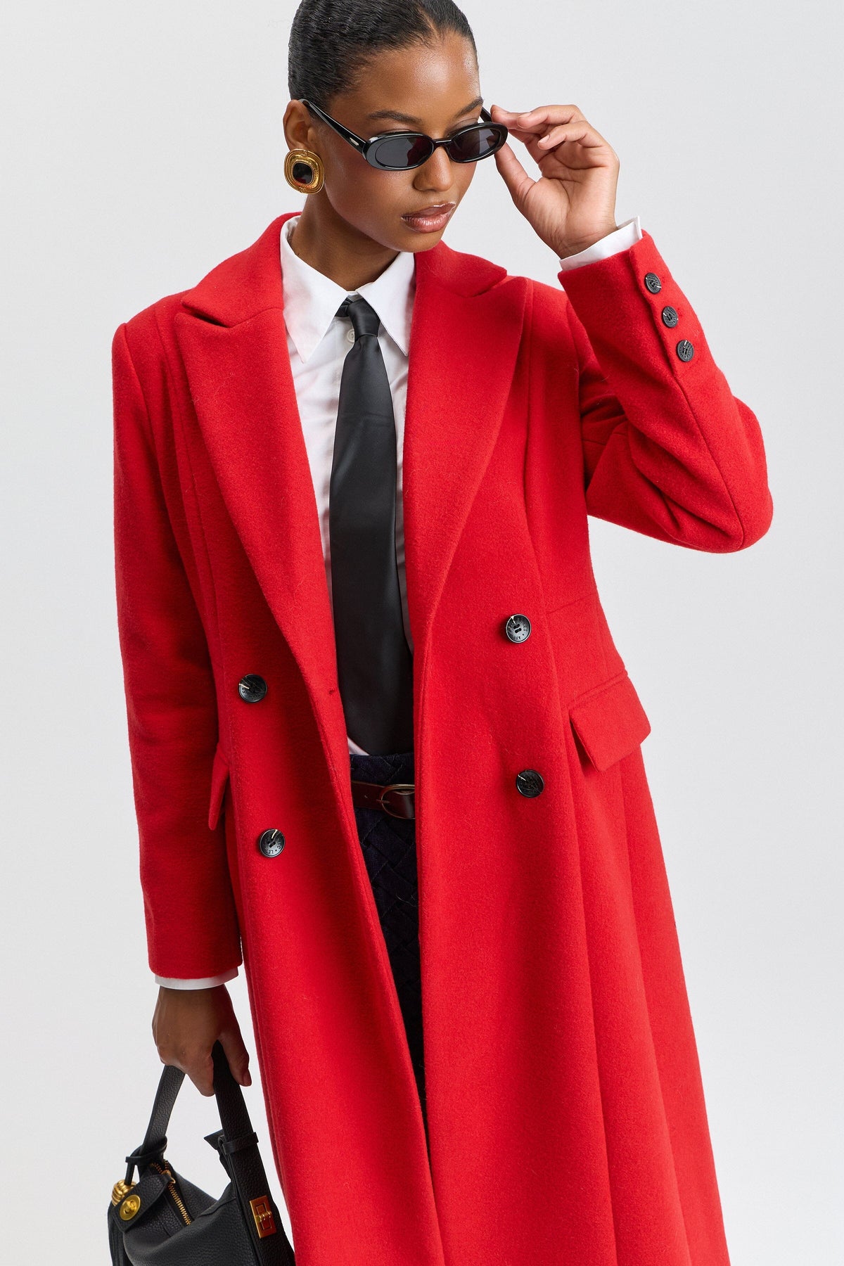 Double-breasted long red coat women with a notched lapel collar. Shop cute long coats by Avec Les Filles.