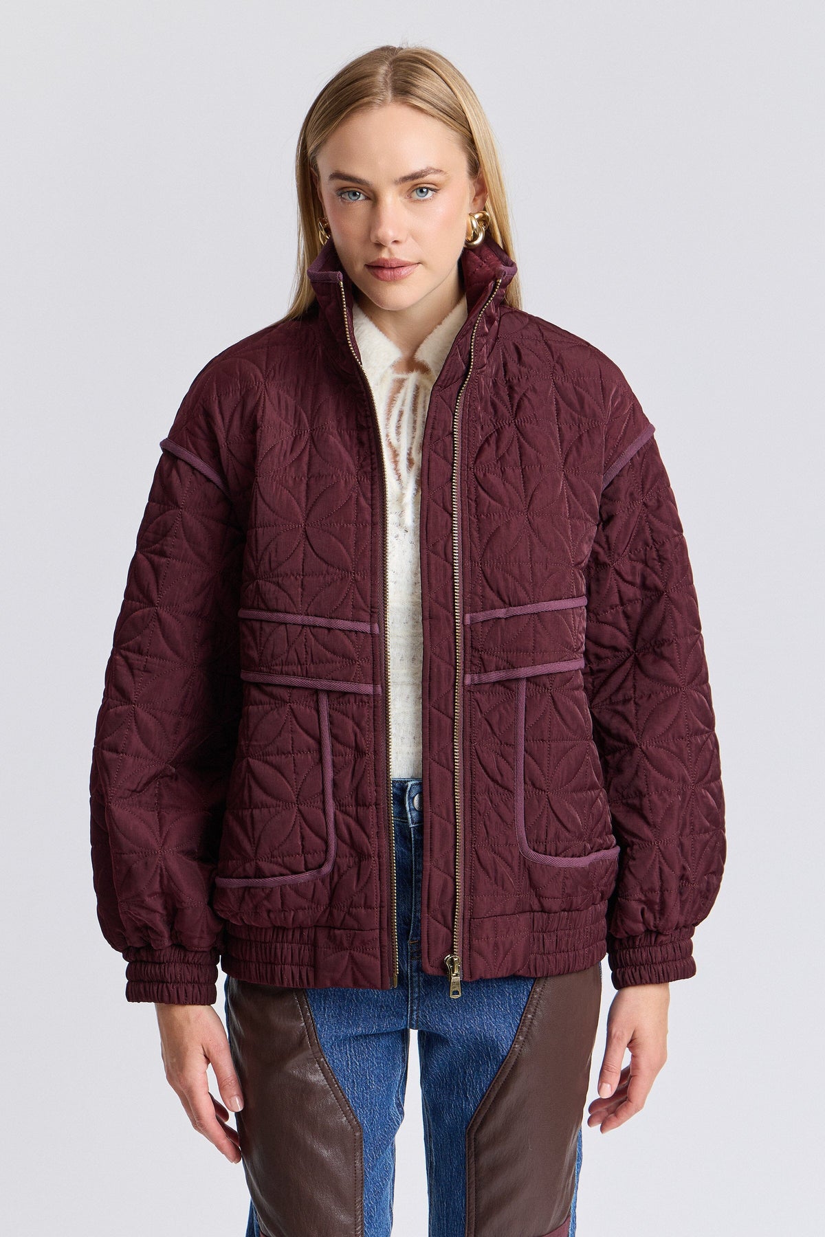 Quilted purple bomber jacket with a zip front and long sleeves - Shop women's bomber jackets by Avec Les Filles.