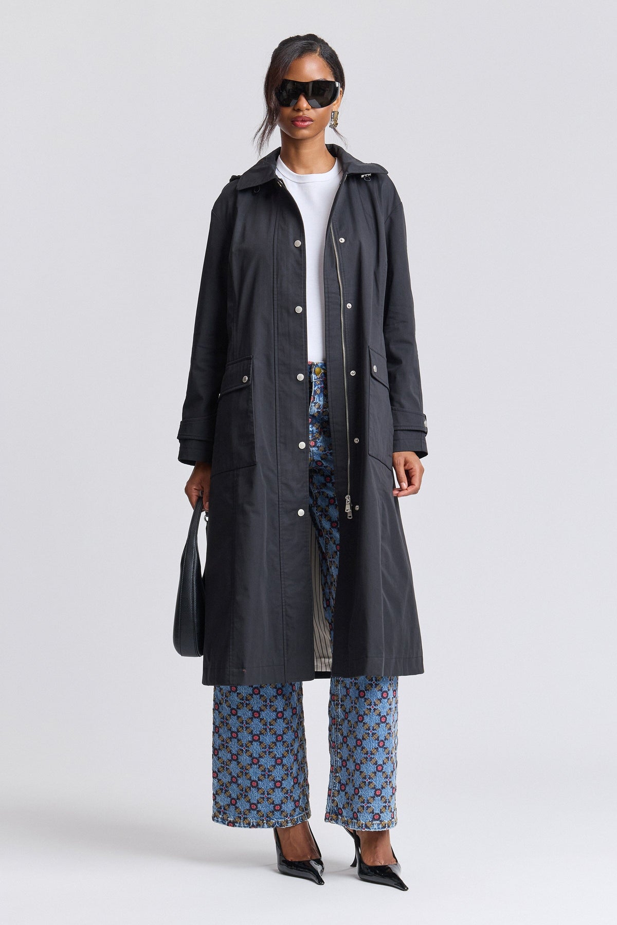 Long black rain coat anorak with long sleeves and snap-front - Shop women's long coats by Avec Les Filles.