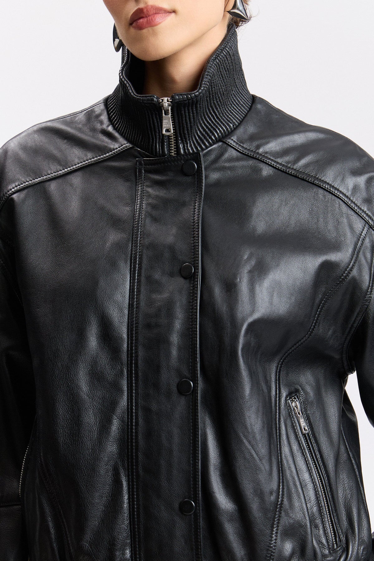 Black leather bomber jacket with a front zip and snap buttons - Shop women's jackets by Avec Les Filles.