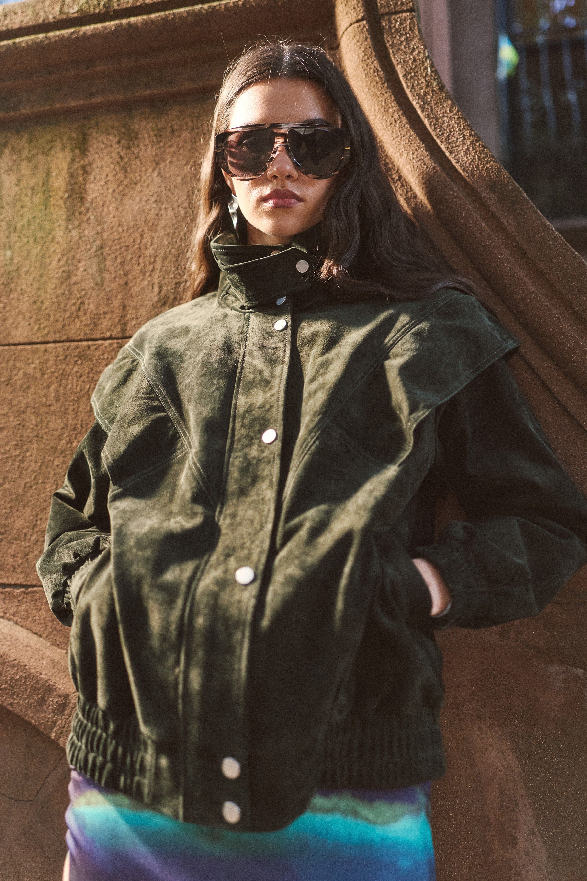 Genuine suede layered yoke green bomber jacket with high stand collar and long sleeves by Avec Les Filles.