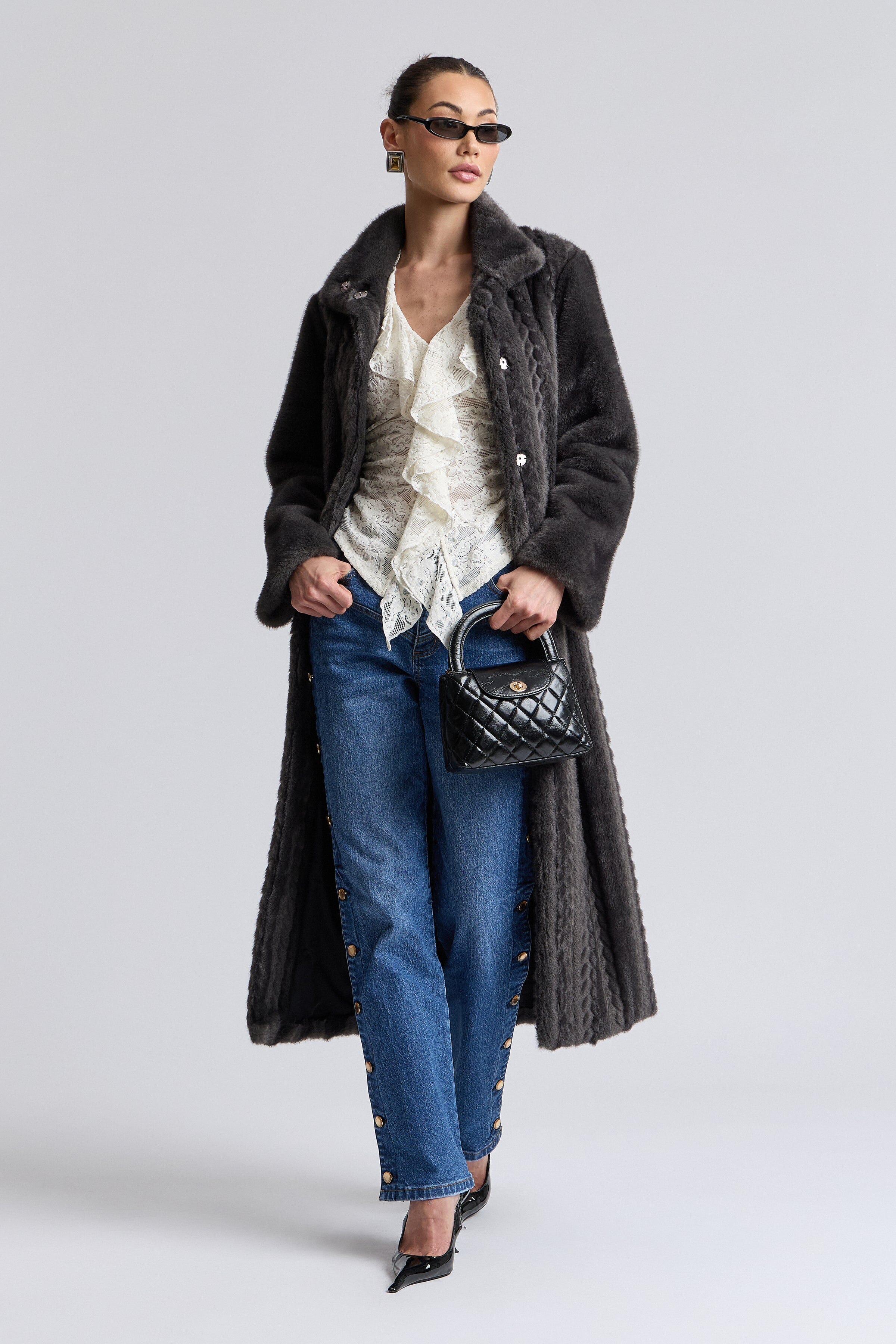 Striped black long faux fur coat with long sleeves and snap closure - Shop women's long mink coats by Avec Les Filles.
