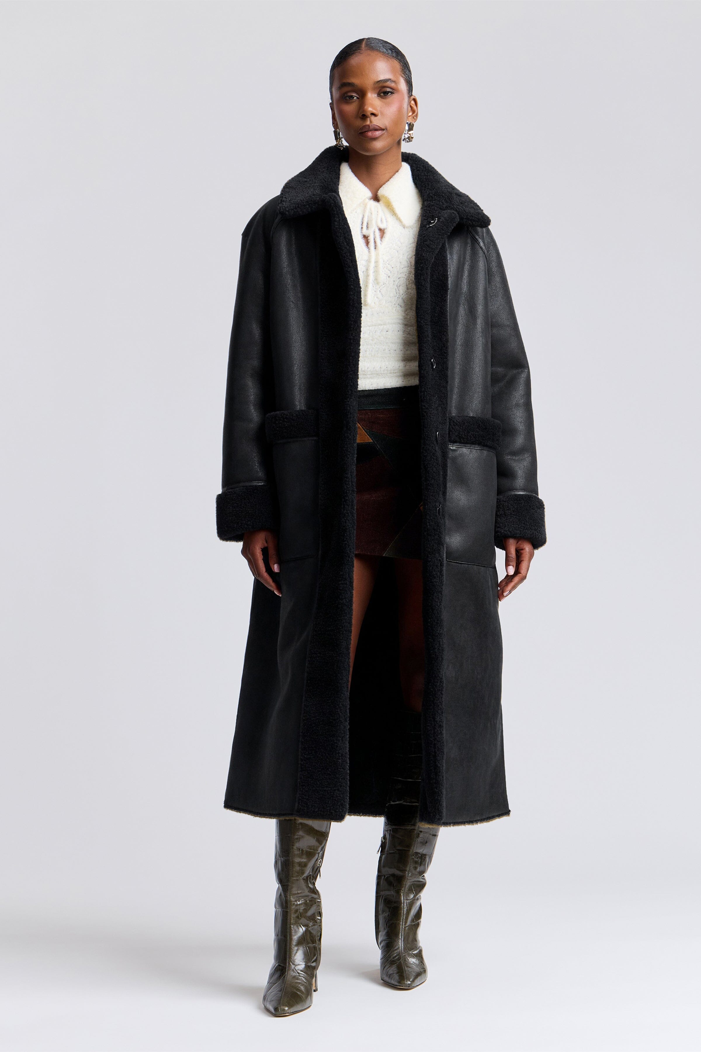 Reversible faux black shearling coat with front button and raglan sleeves - Shop women's long coats by Avec Les Filles.