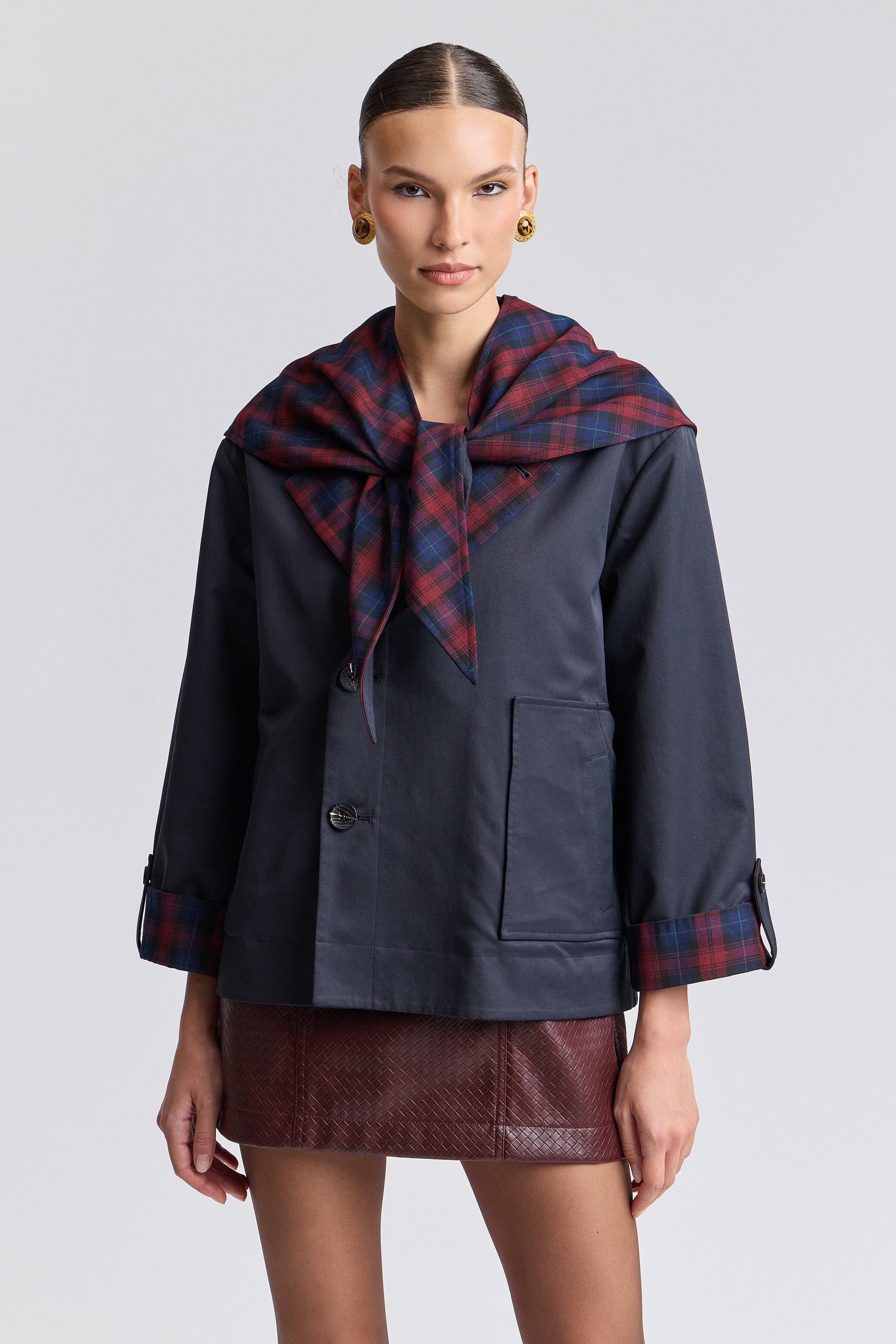 Reversible plaid barn jacket in a cotton blend with a point collar and detachable plaid scarf by Avec Les Filles.