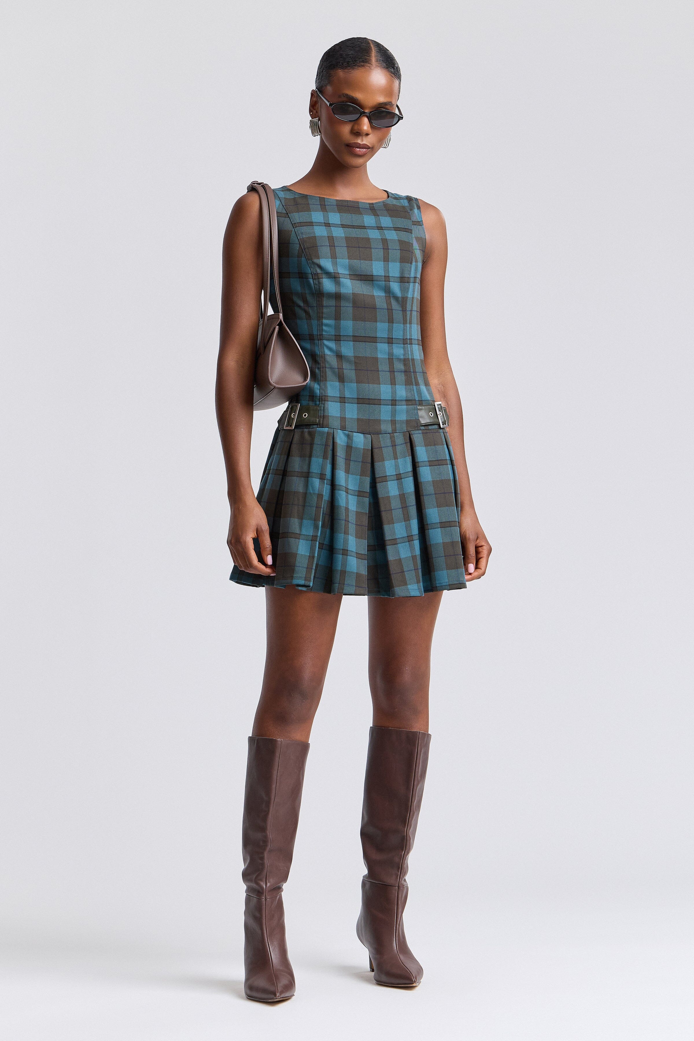 Blue plaid sleeveless dress with drop-waist and boat neckline. Shop women's cute mini dresses by Avec Les Filles.