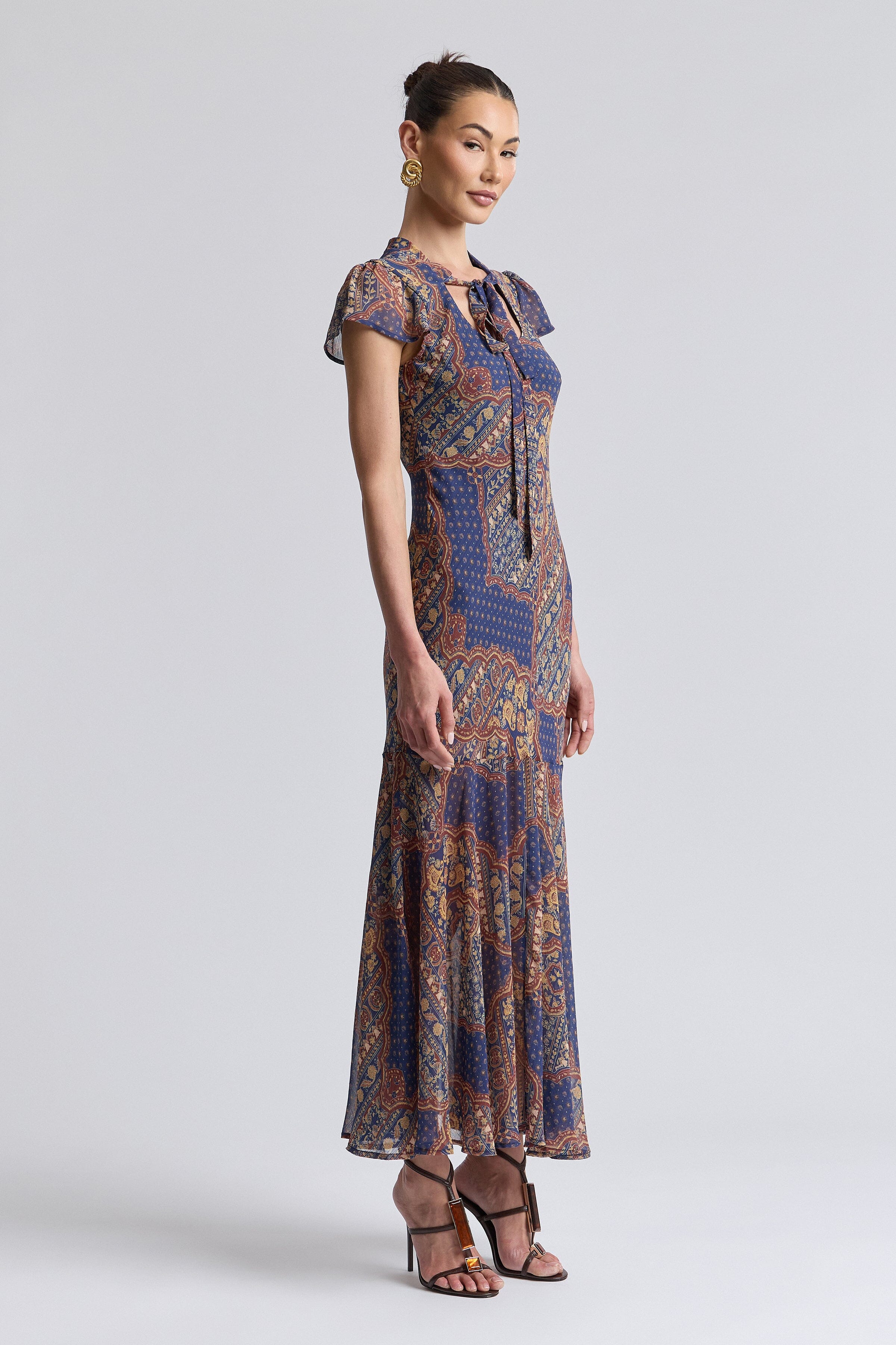 Chiffon blue paisley print dress with front-tie neckline and short flutter sleeves - Shop maxi dresses by Avec Les Filles.