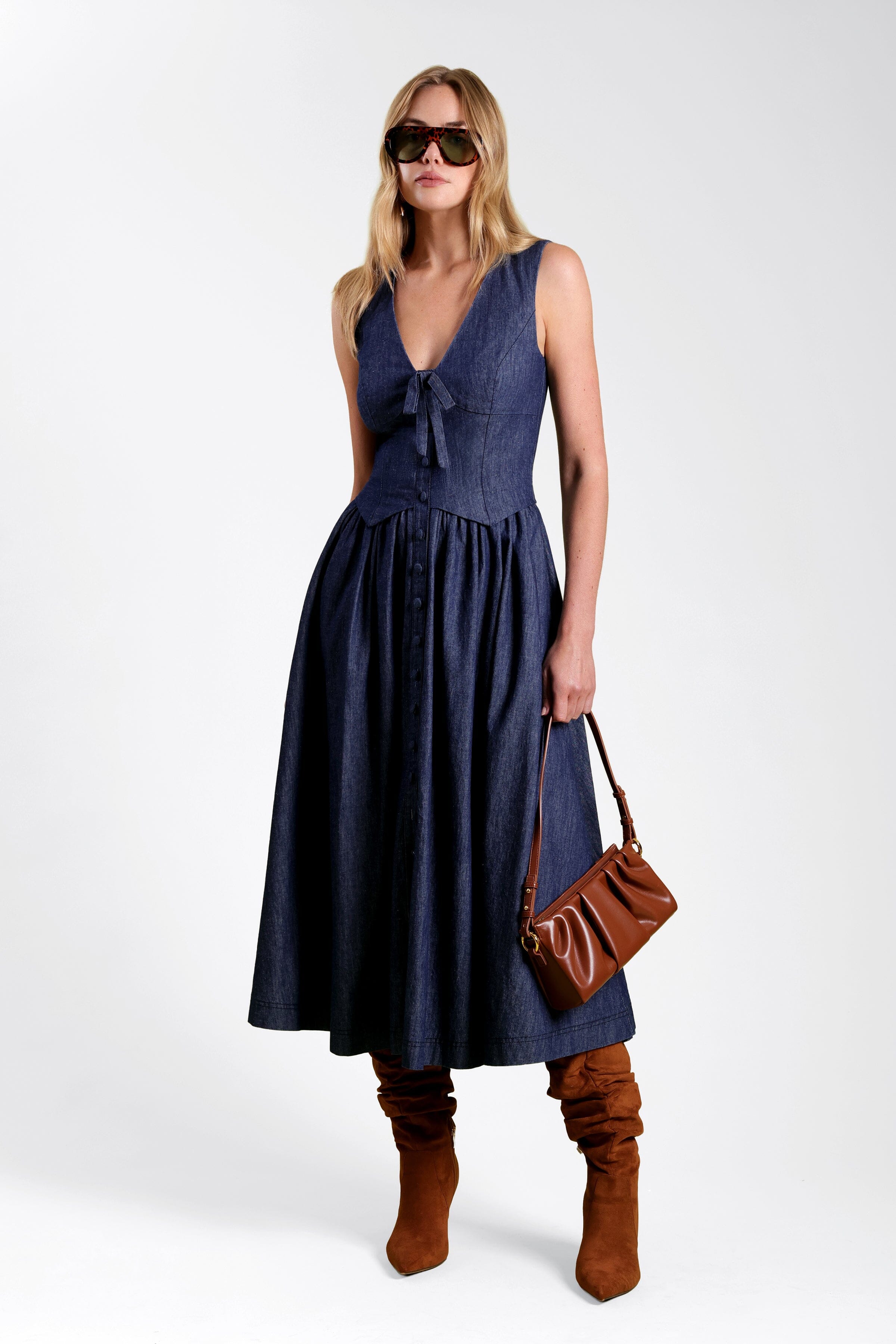 Drop-waist maxi sleeveless denim dress in cotton with tie-front and deep V-neck - Shop denim dresses by Avec Les Filles.