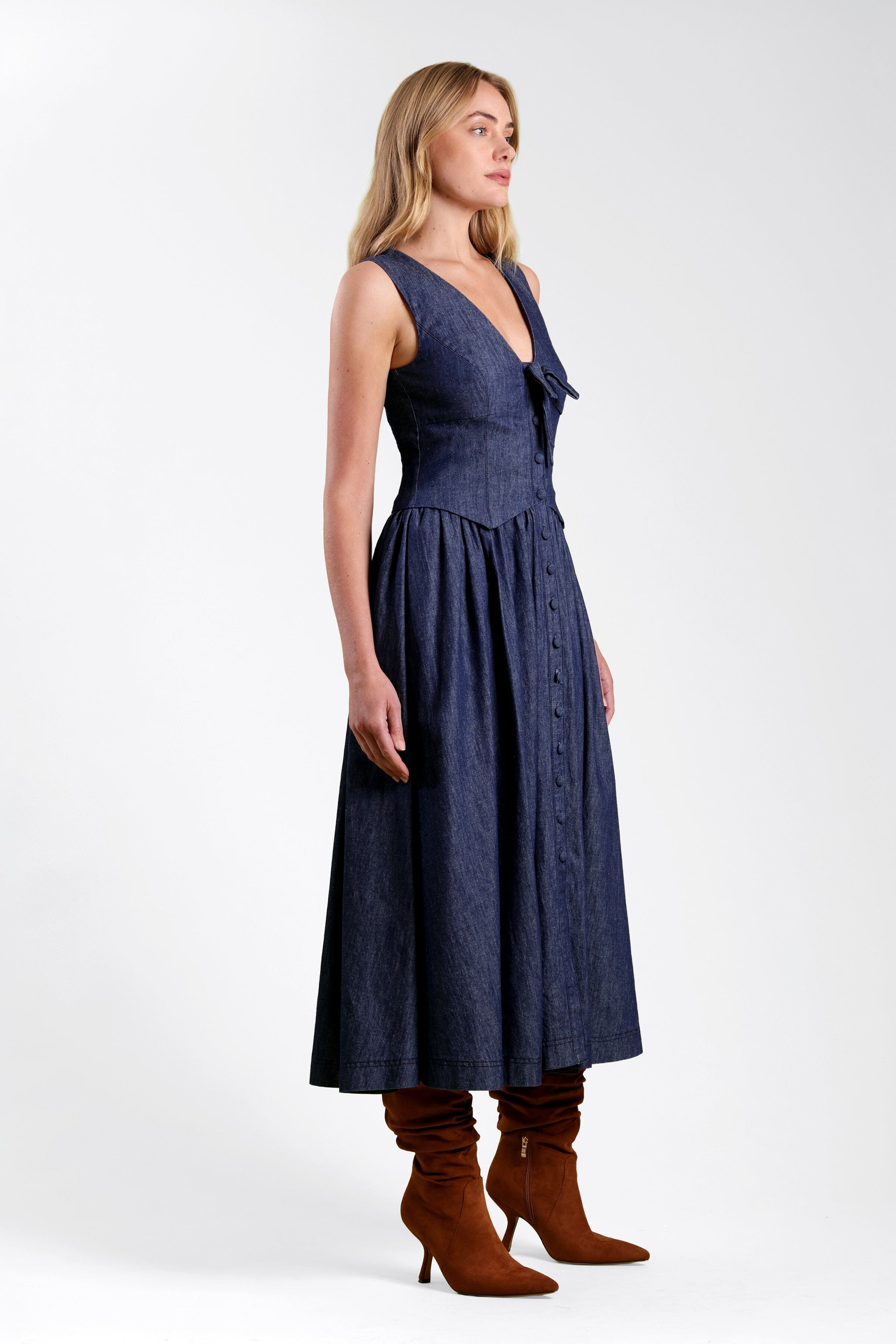 Drop-waist long denim dress in cotton with a tie-front and deep V-neck - Shop cute denim dresses by Avec Les Filles.