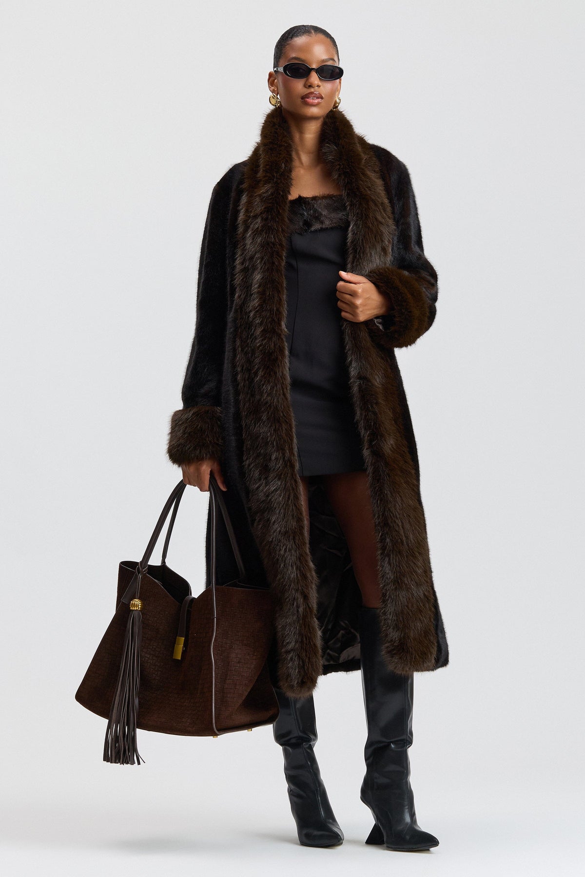 Fit-and-flare black faux fur full length coat with shawl collar. Shop women's cute faux fur jackets by Avec Les Filles.