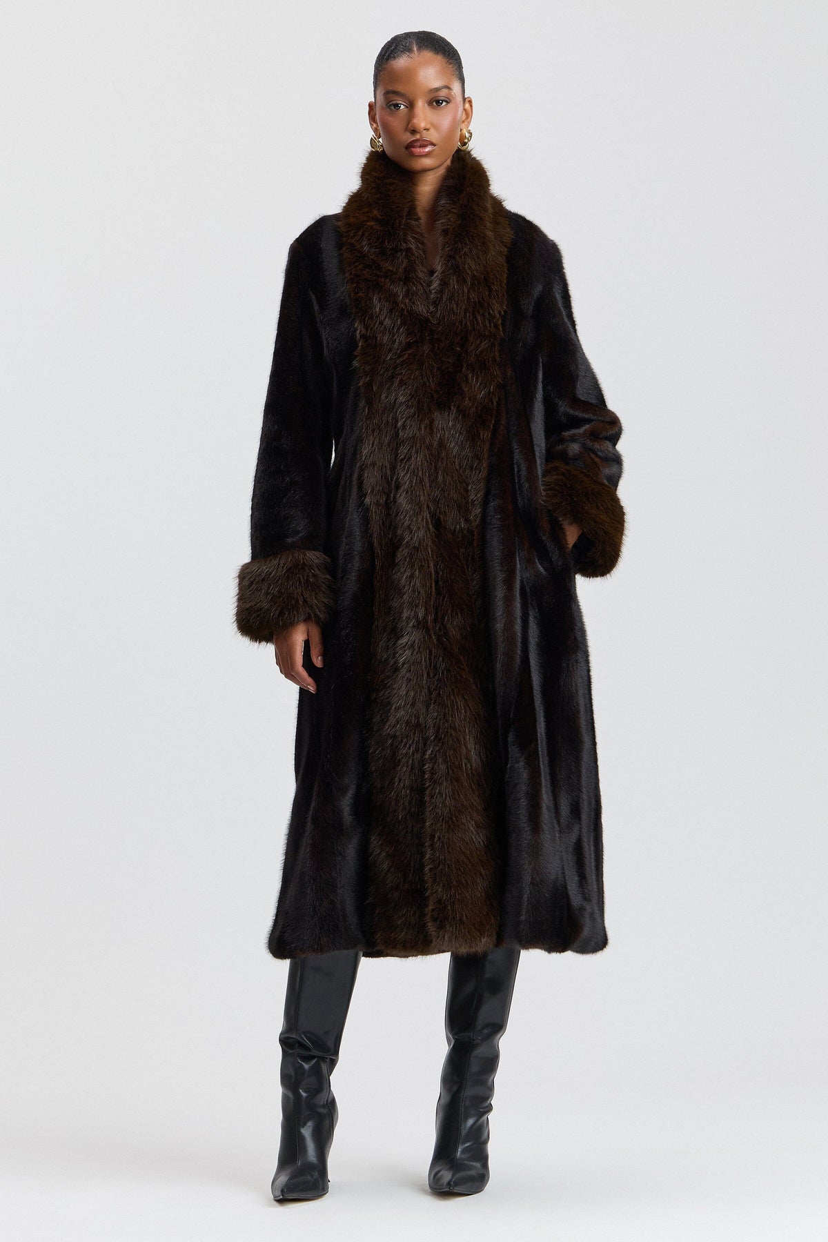 Fit-and-flare black faux fur coat long jacket with a shawl collar. Shop designer faux fur jackets by Avec Les Filles.