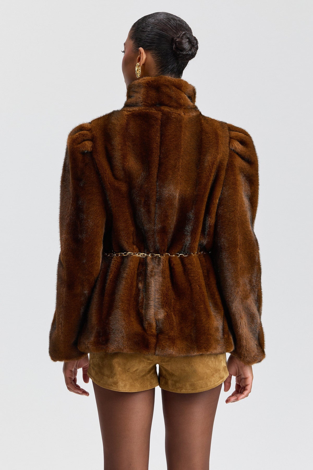 Brown mink puff-sleeve faux fur jacket with high stand collar. Shop women's cute faux fur jackets by Avec Les Filles.