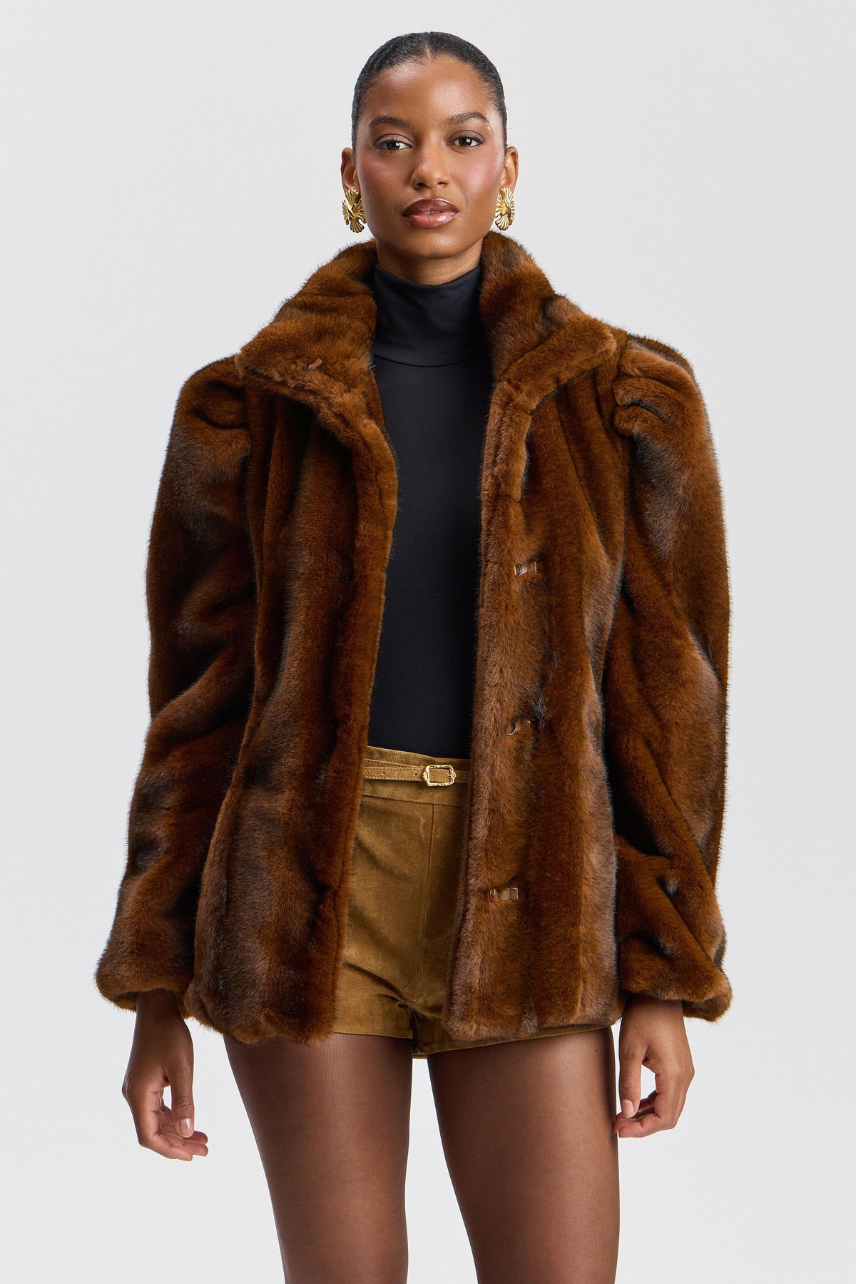 Puff-sleeve brown fur jacket with a chain belt and stand collar. Shop women's cute faux fur jackets by Avec Les Filles.