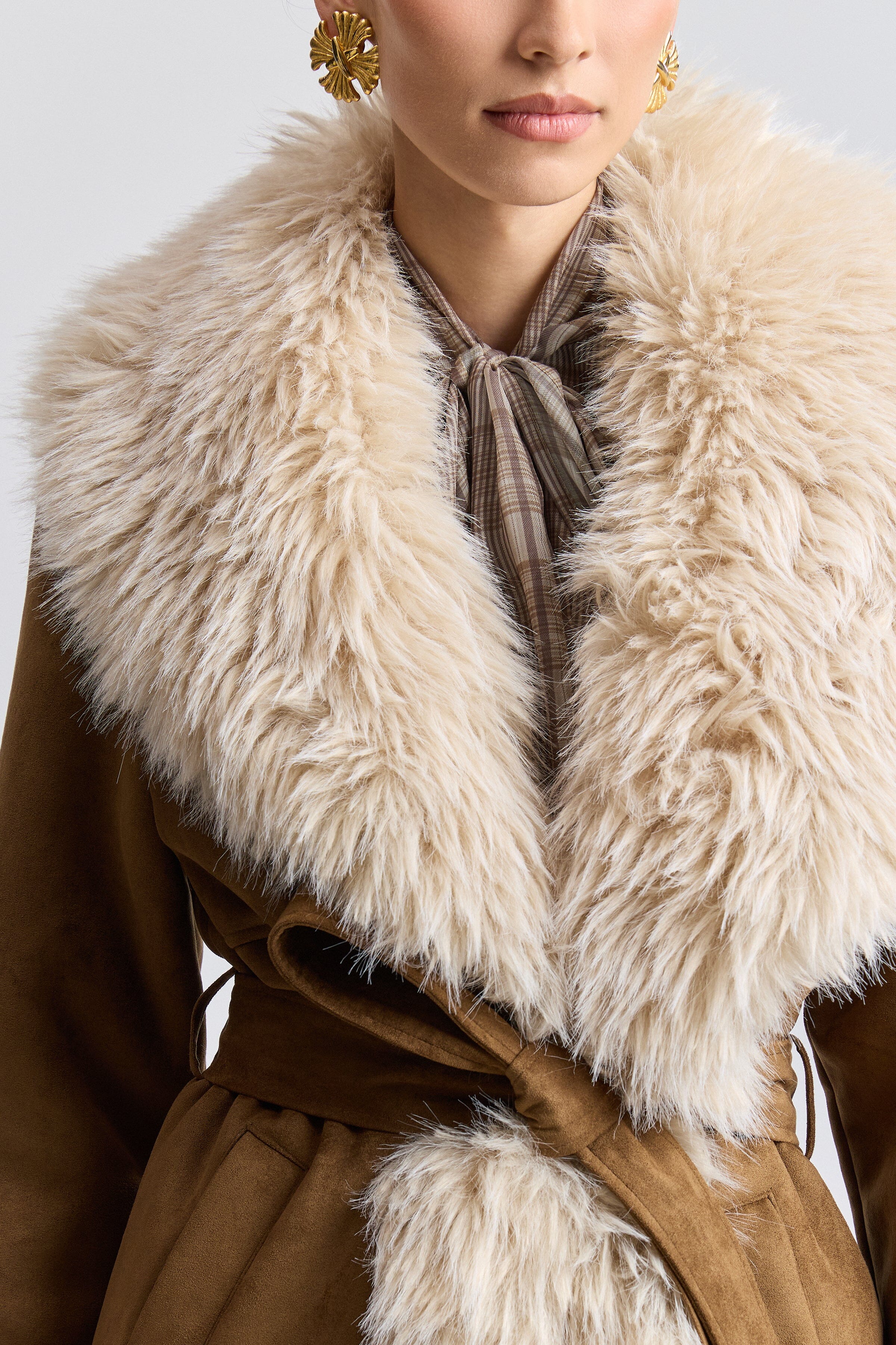 Light brown faux shearling coat with removable belt and long sleeves. Shop women's long coats by Avec Les Filles 